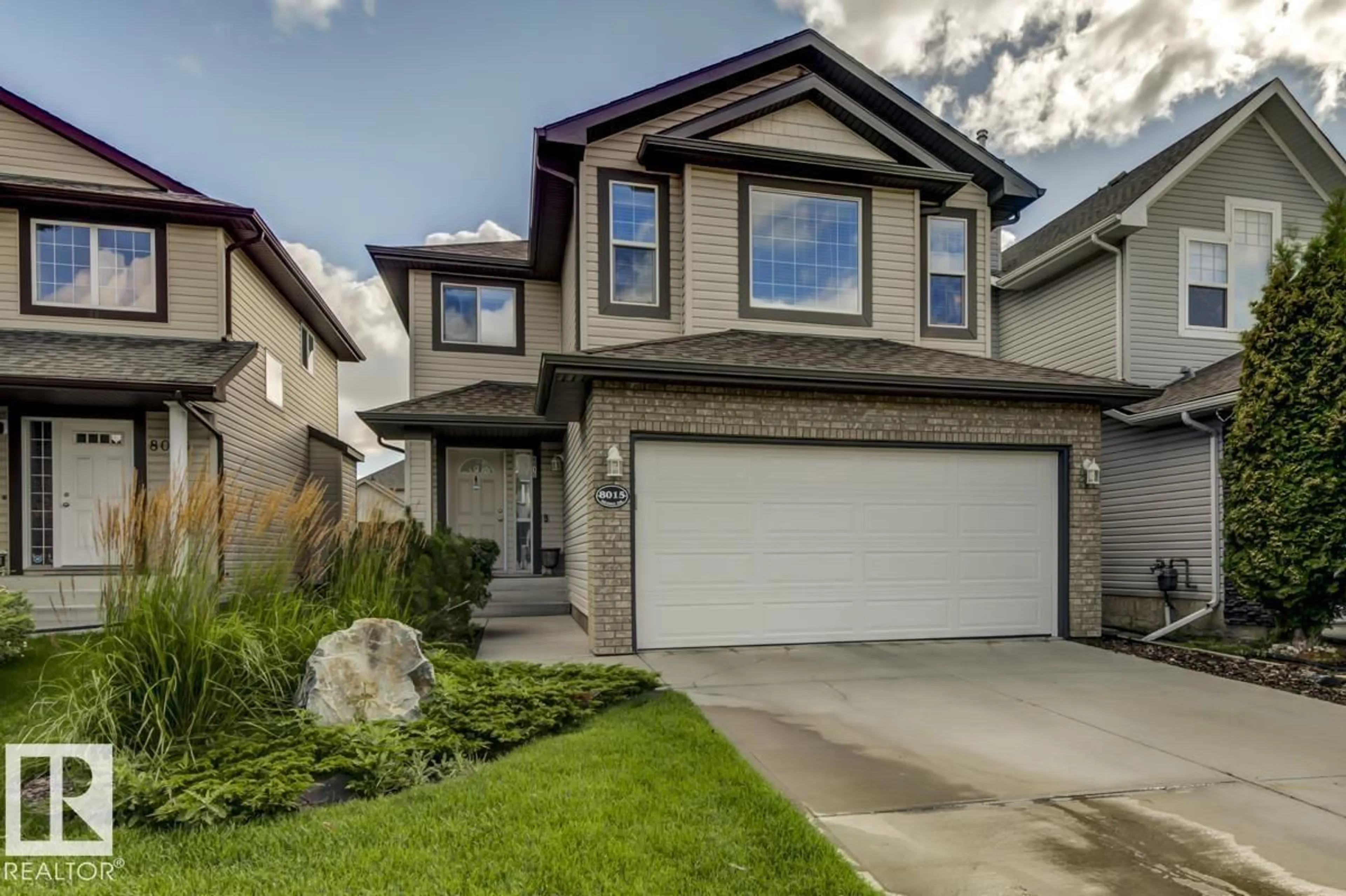 Home with vinyl exterior material, street for 8015 SHASKE DR, Edmonton Alberta T6R3V9