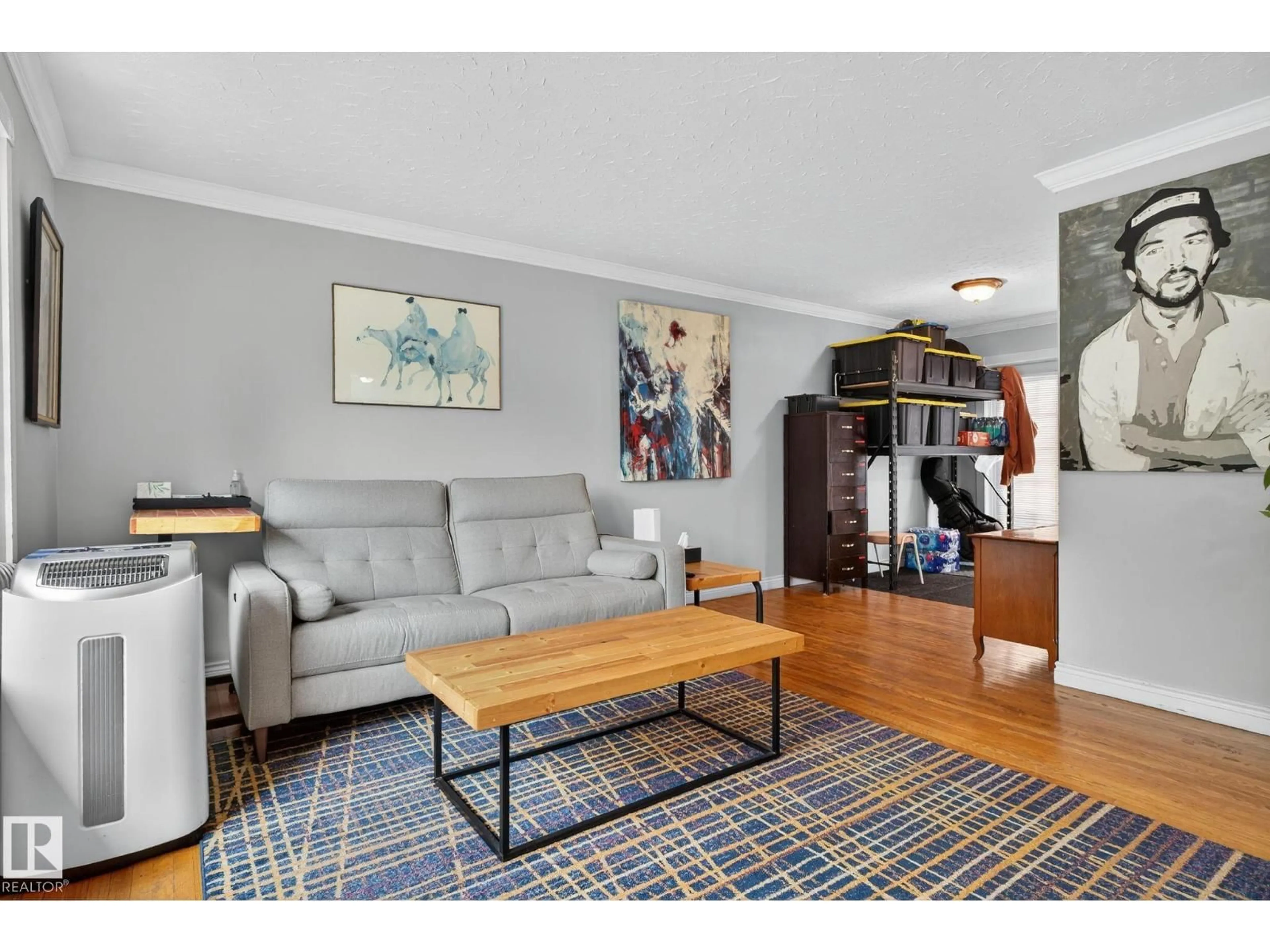 Living room with furniture, wood/laminate floor for NW - 10615 149 ST, Edmonton Alberta T5P1L9