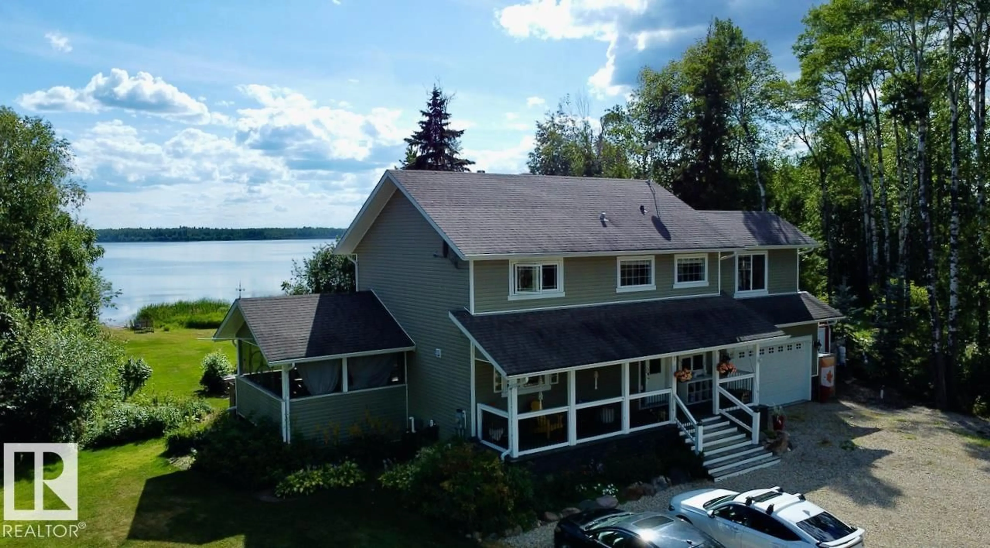 A pic from outside/outdoor area/front of a property/back of a property/a pic from drone, water/lake/river/ocean view for 310 55530 RGE ROAD 52, Rural Lac Ste. Anne County Alberta T0E0J0