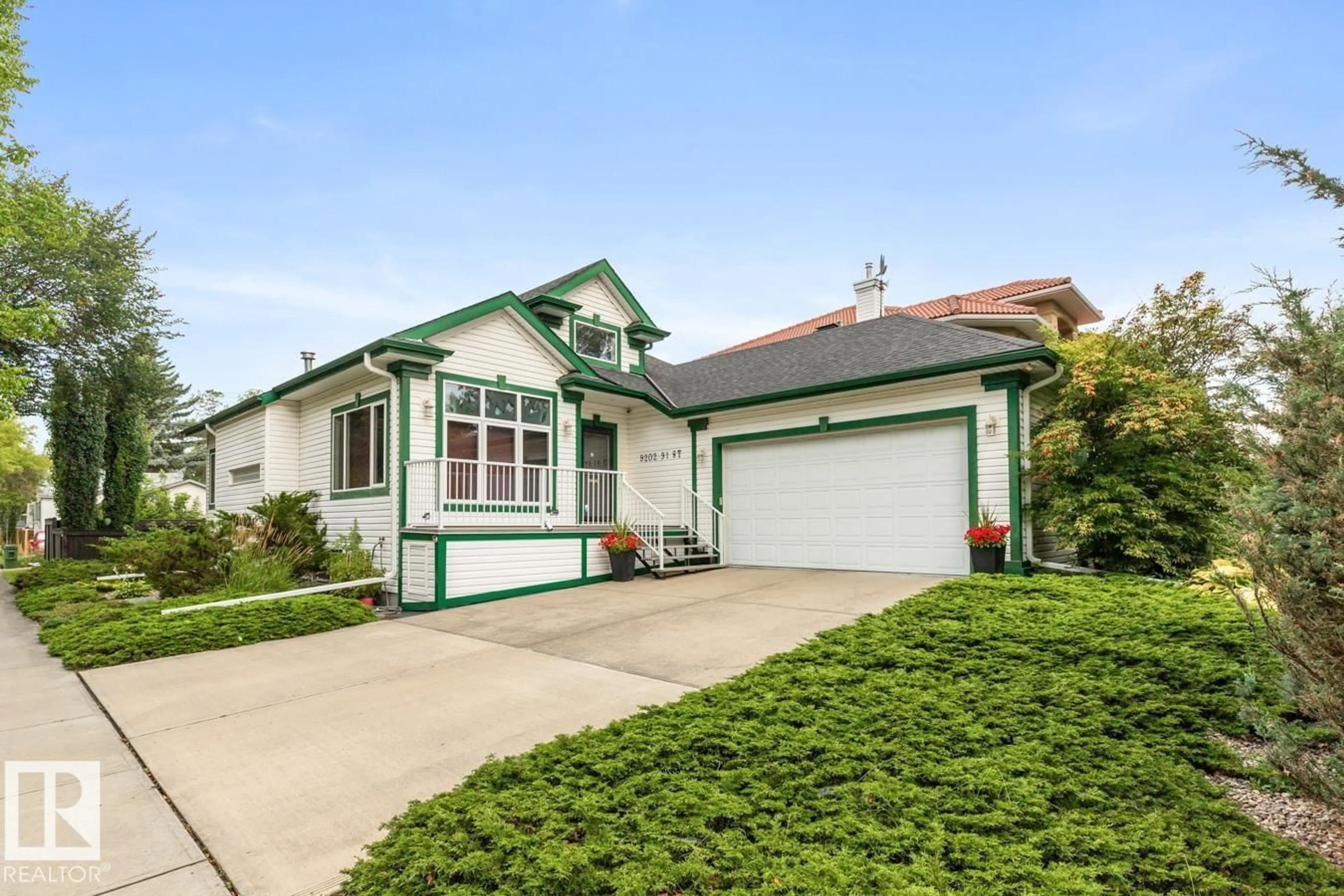 Home with vinyl exterior material, street for NW - 9202 91 ST, Edmonton Alberta T6C3N8