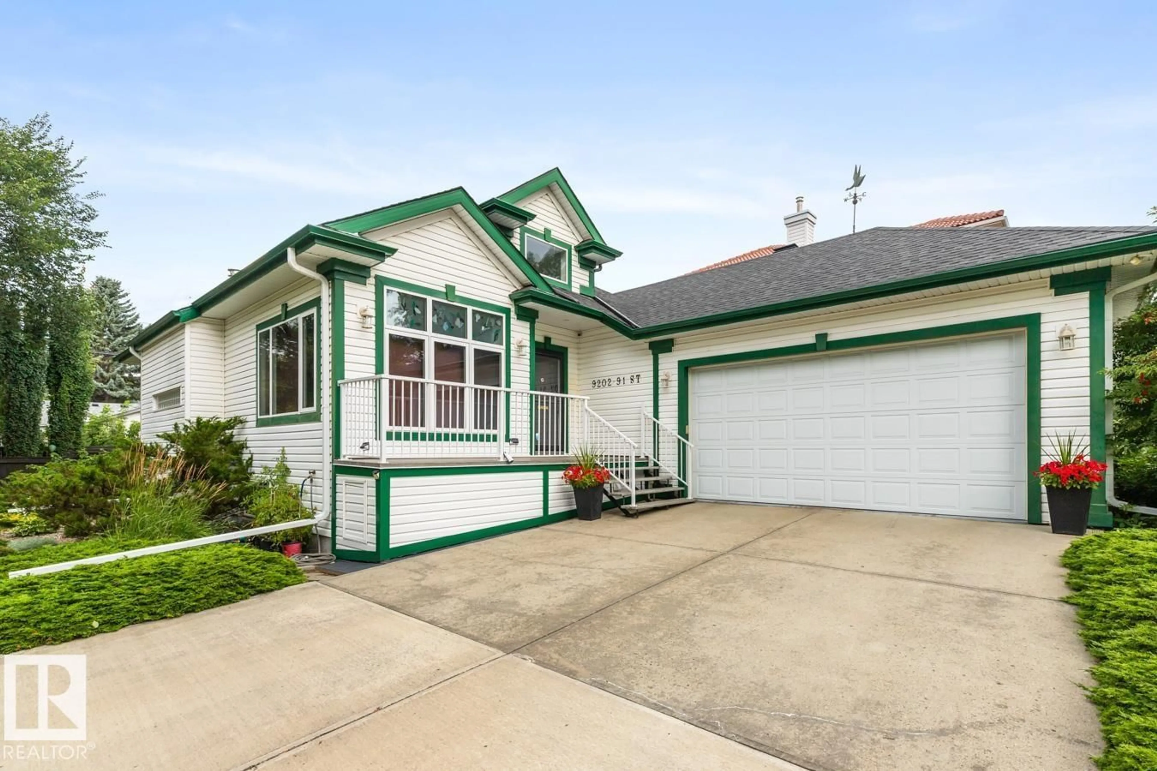 Home with vinyl exterior material, street for NW - 9202 91 ST, Edmonton Alberta T6C3N8
