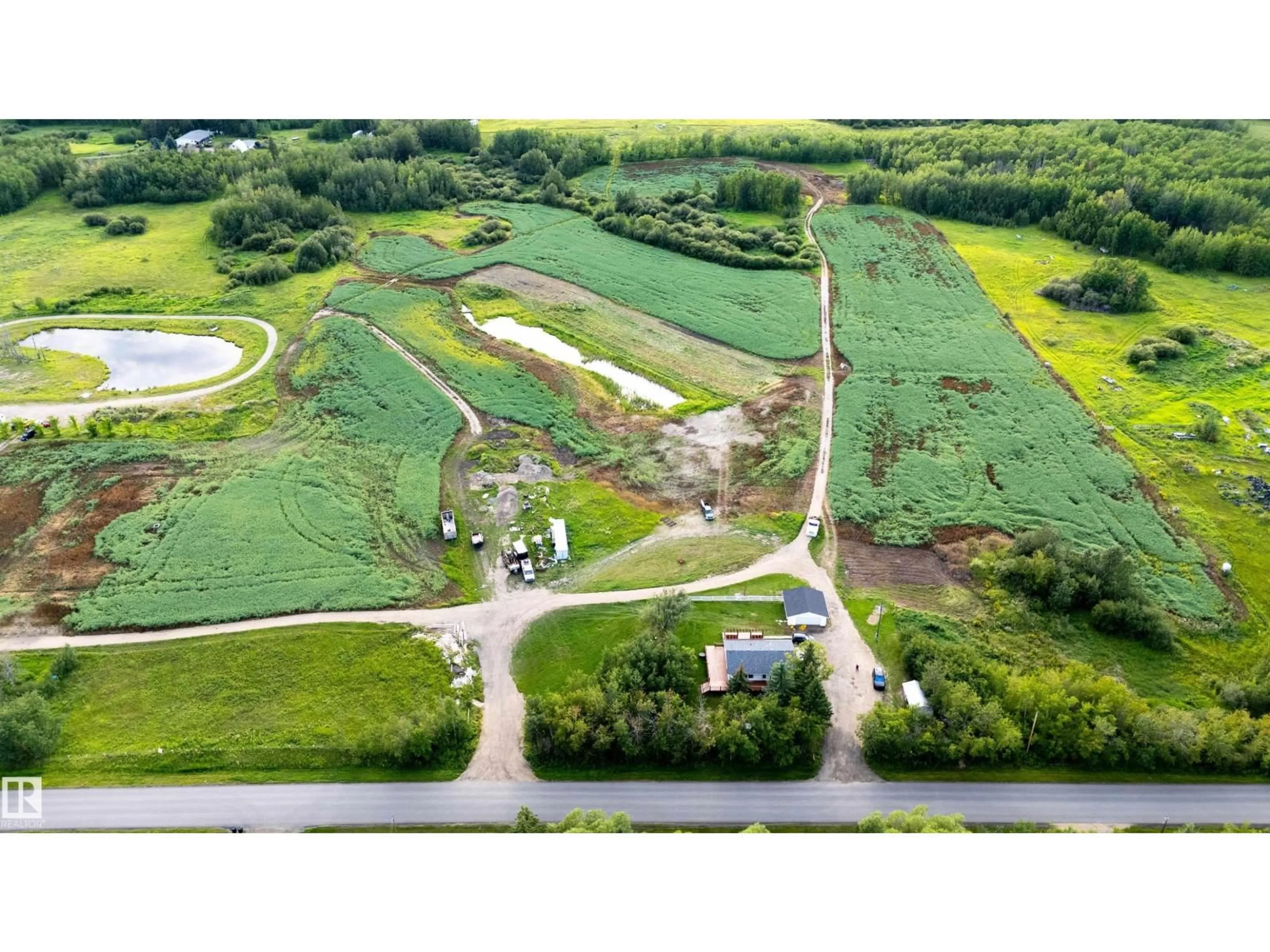 A pic from outside/outdoor area/front of a property/back of a property/a pic from drone, water/lake/river/ocean view for 52028 RANGE RD 231, Rural Strathcona County Alberta T8B1A3