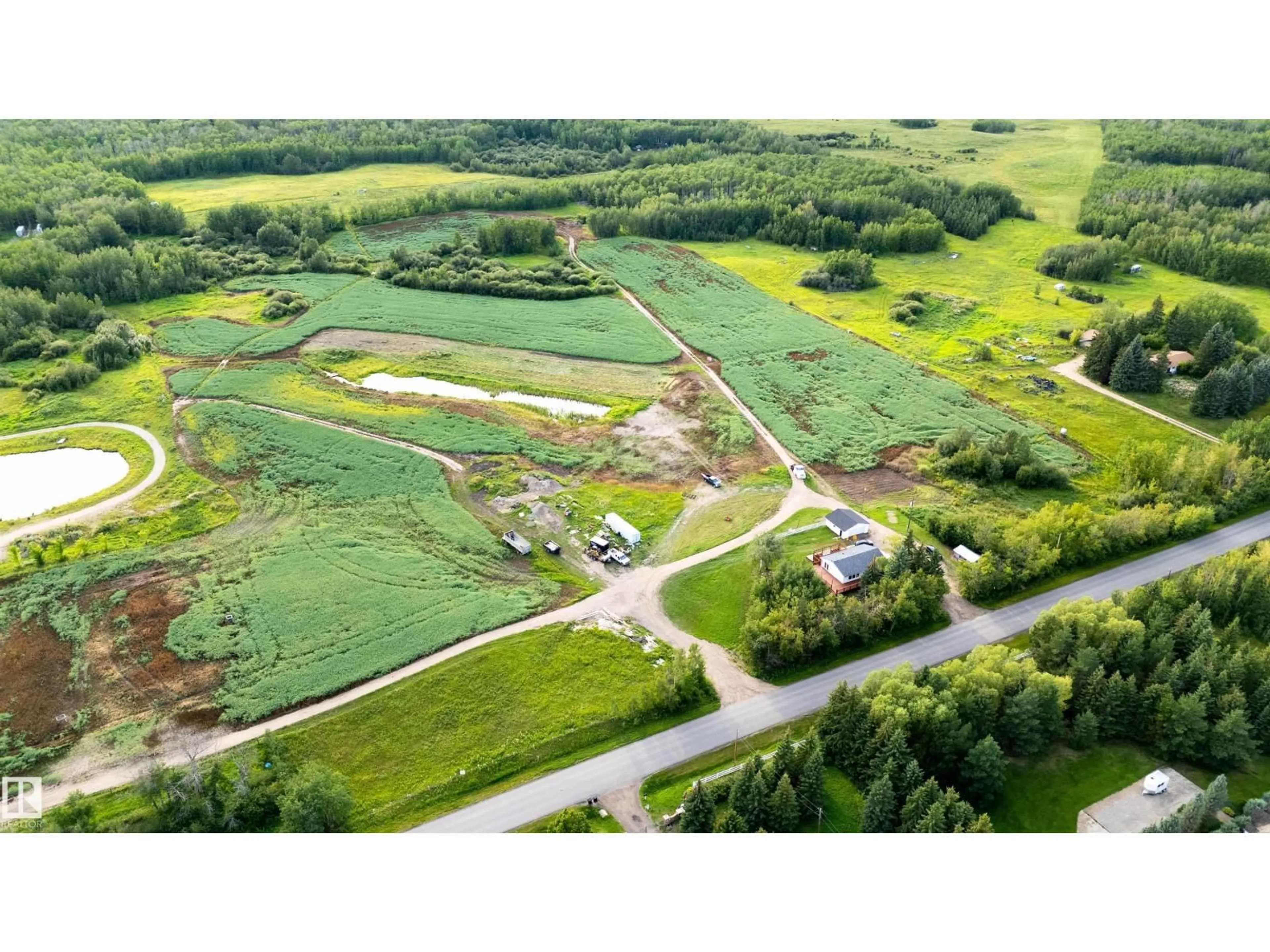 A pic from outside/outdoor area/front of a property/back of a property/a pic from drone, unknown for 52028 RANGE RD 231, Rural Strathcona County Alberta T8B1A3