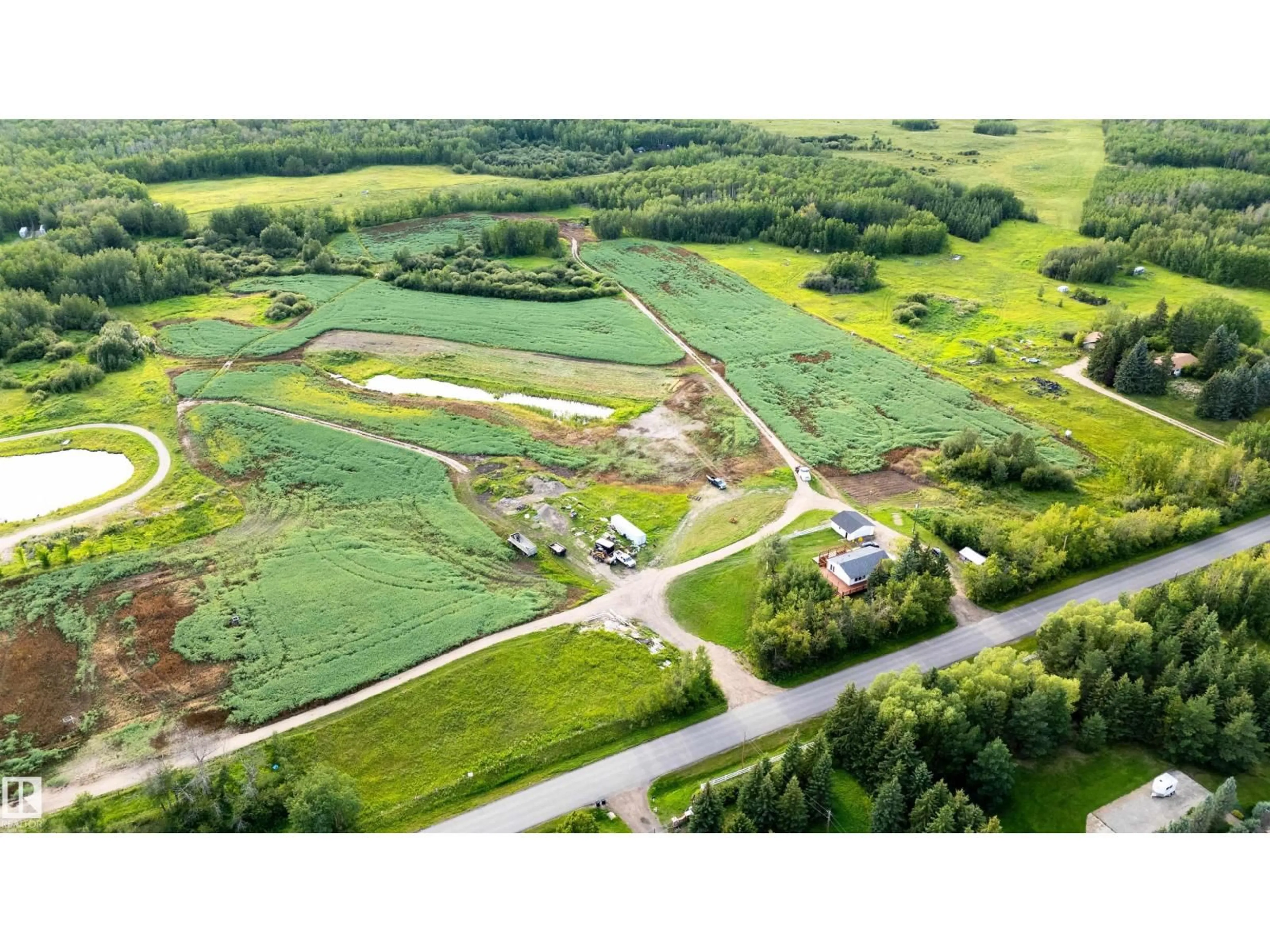 A pic from outside/outdoor area/front of a property/back of a property/a pic from drone, street for 52028 RANGE RD 231, Rural Strathcona County Alberta T8B1A3