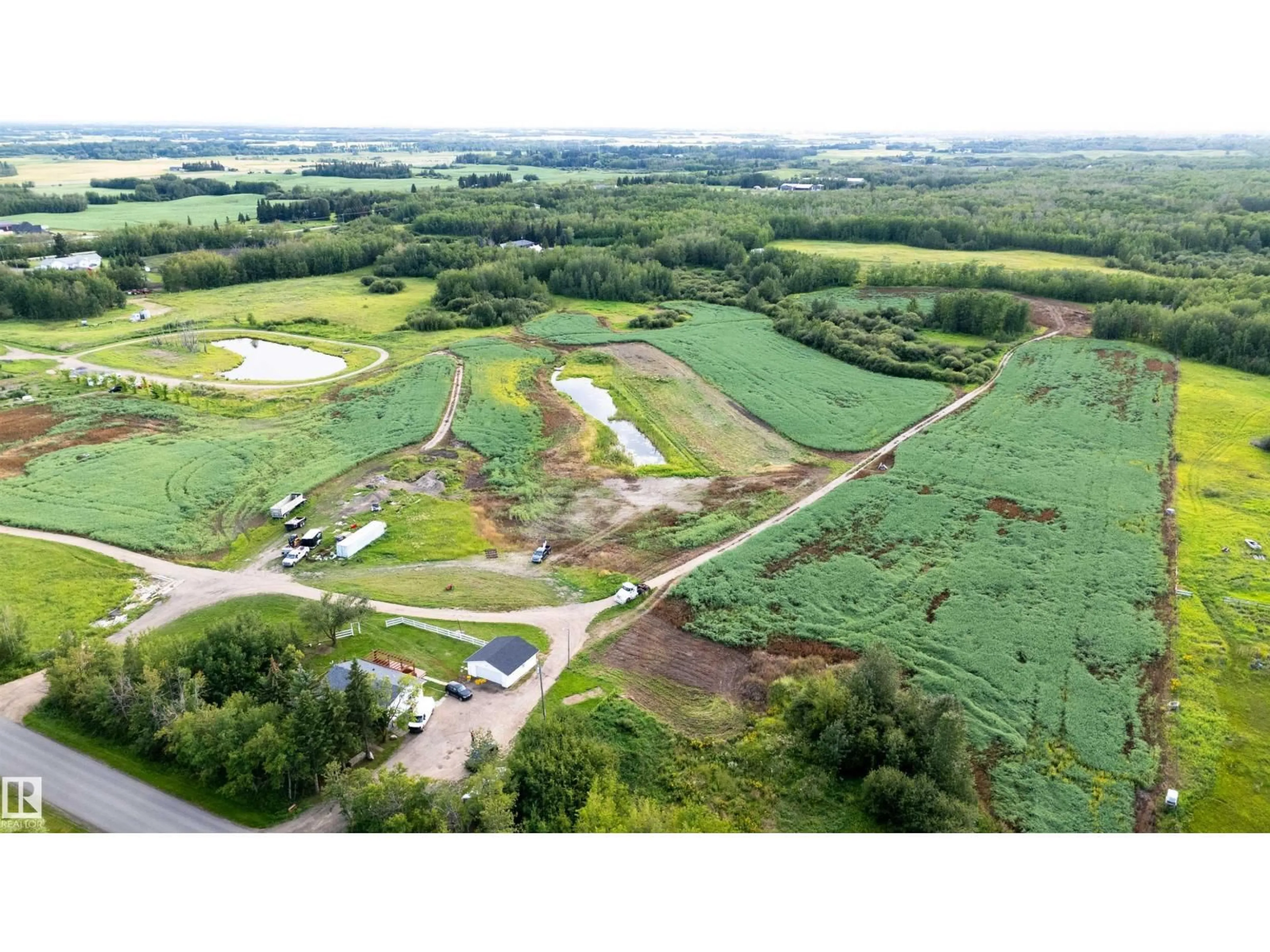 A pic from outside/outdoor area/front of a property/back of a property/a pic from drone, unknown for 52028 RANGE RD 231, Rural Strathcona County Alberta T8B1A3