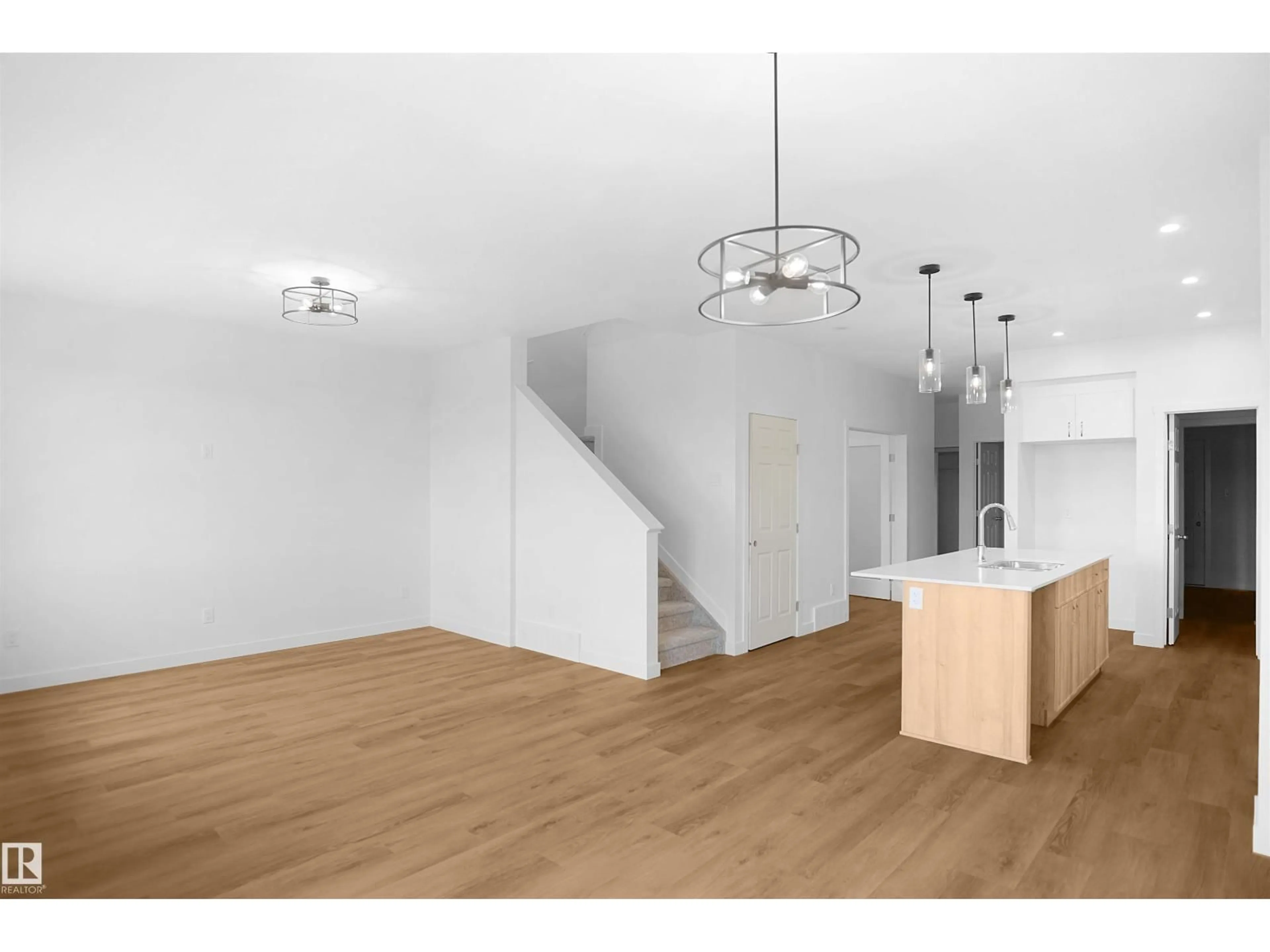 Open concept kitchen, wood/laminate floor for 1332 11 AV, Edmonton Alberta T6T2R6