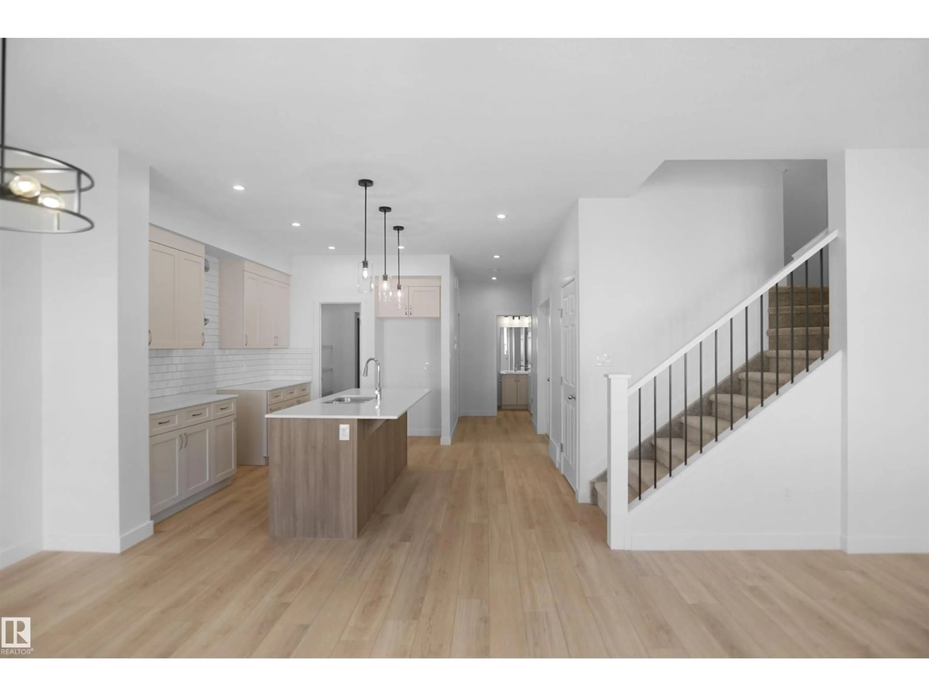 Open concept kitchen, wood/laminate floor for 1503 26 ST, Edmonton Alberta T6T2R6