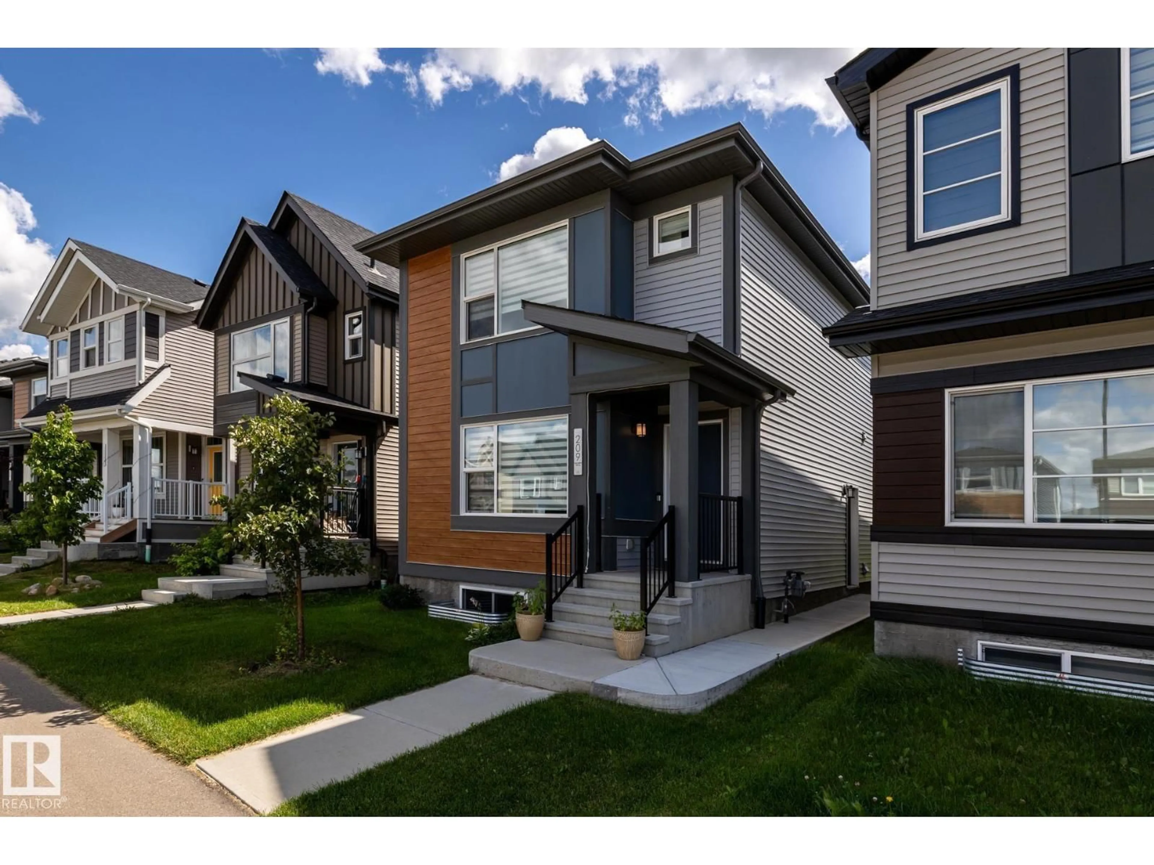 Home with vinyl exterior material, street for 209 CHARLESWORTH DR, Edmonton Alberta T6X2W2
