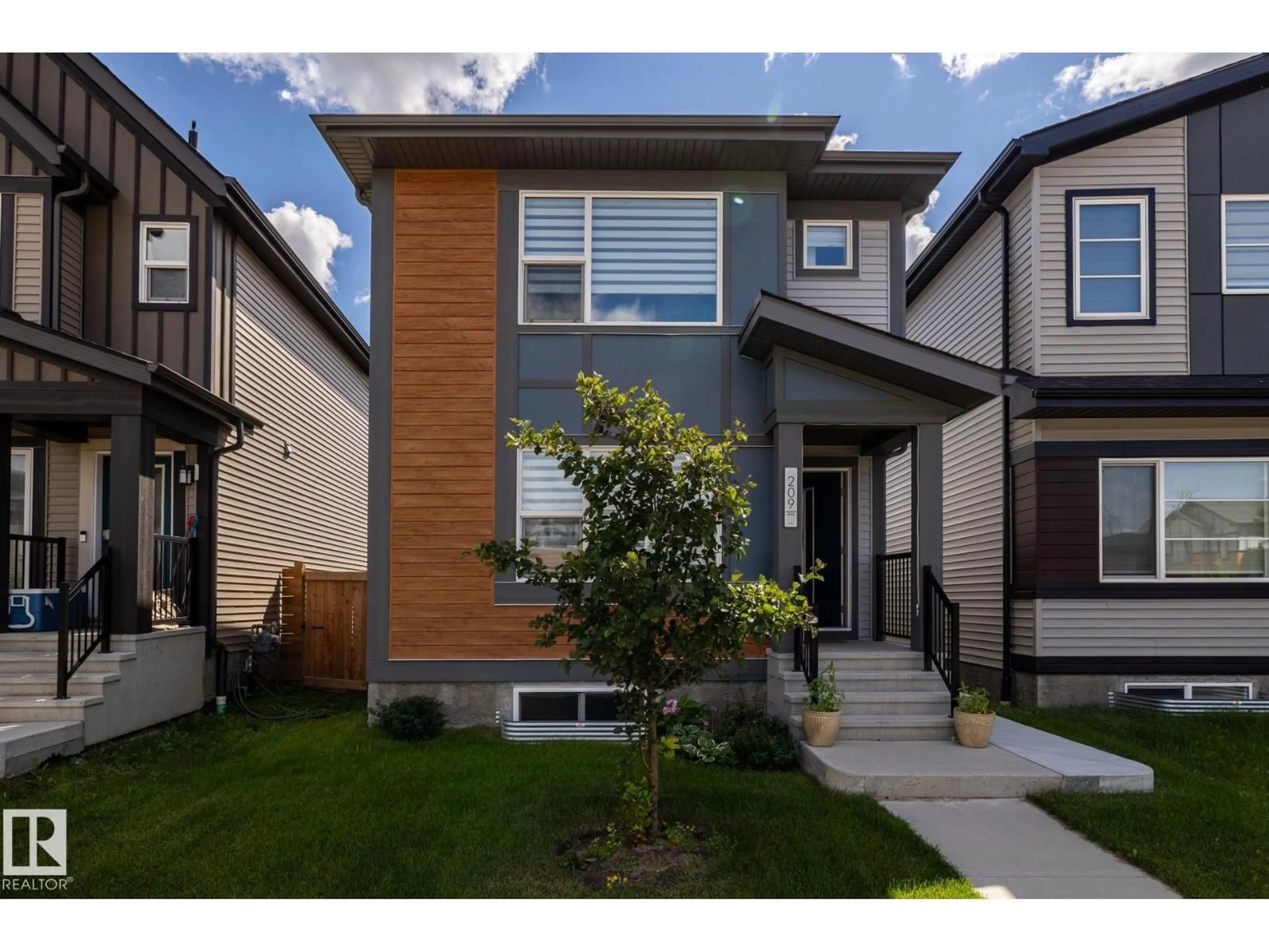 Home with vinyl exterior material, street for 209 CHARLESWORTH DR, Edmonton Alberta T6X2W2