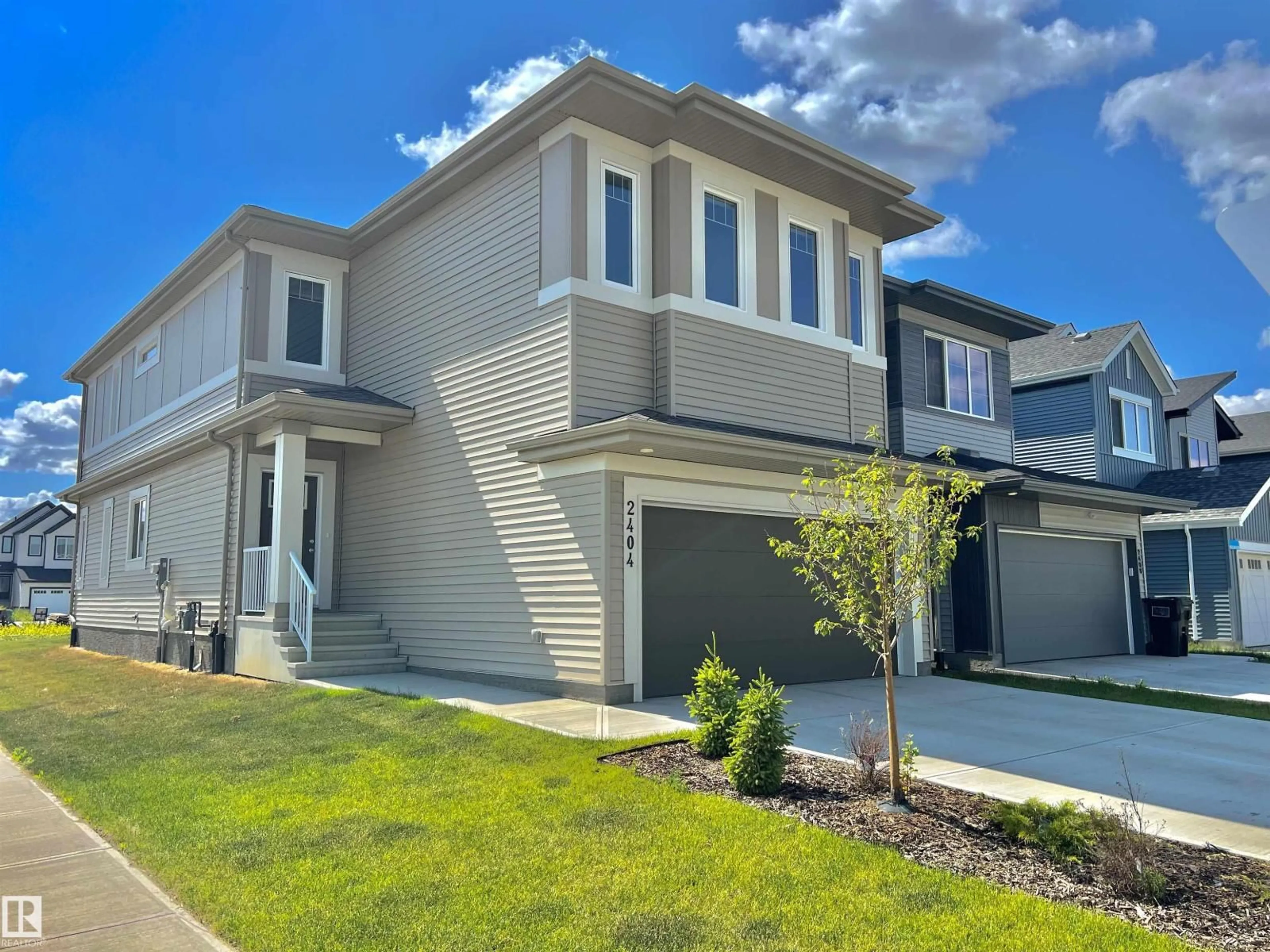 Home with vinyl exterior material, street for NW - 2404 193 ST, Edmonton Alberta T6M2N6