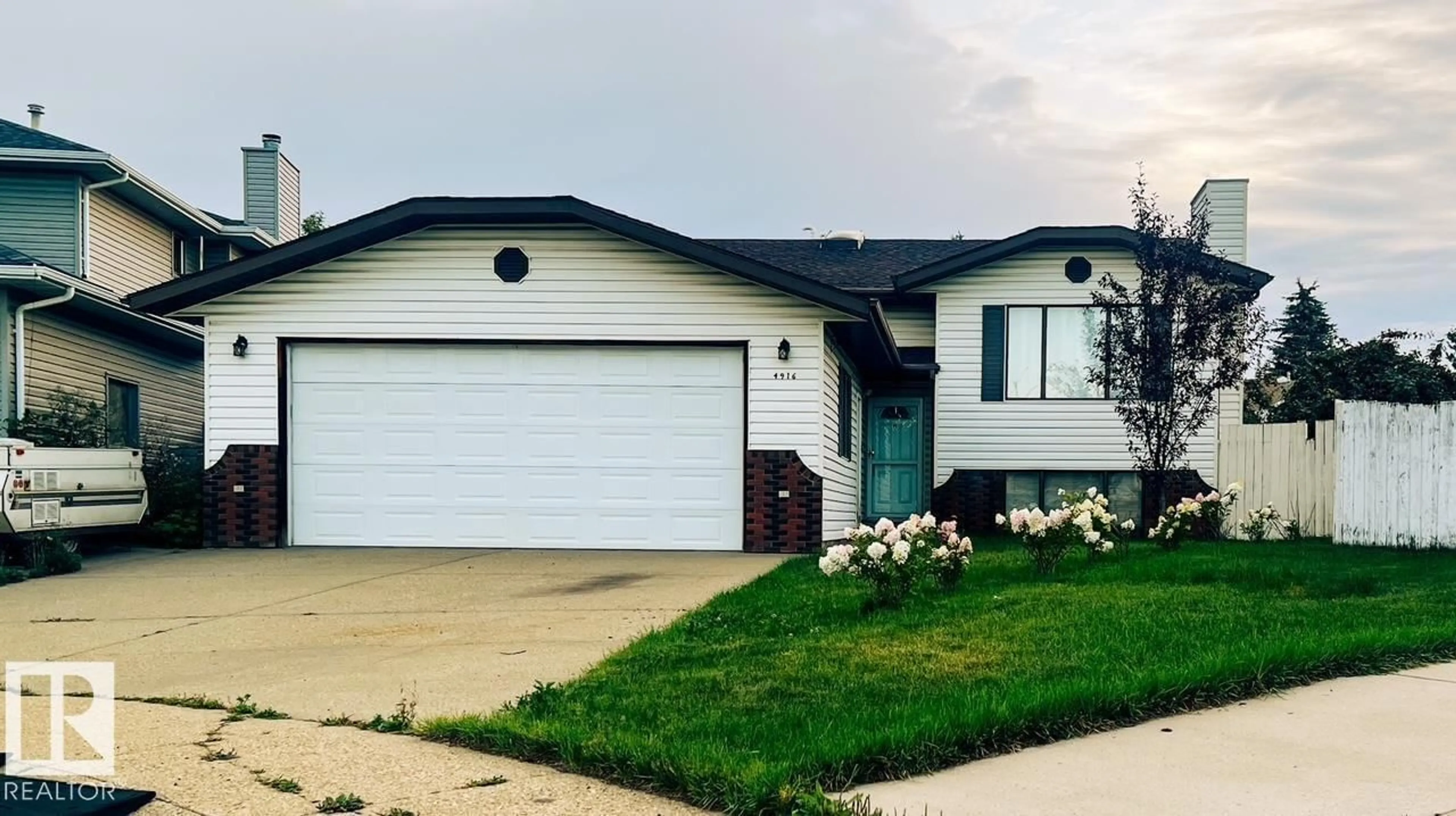 Home with vinyl exterior material, street for 4916 31 AV, Edmonton Alberta T6L5H6