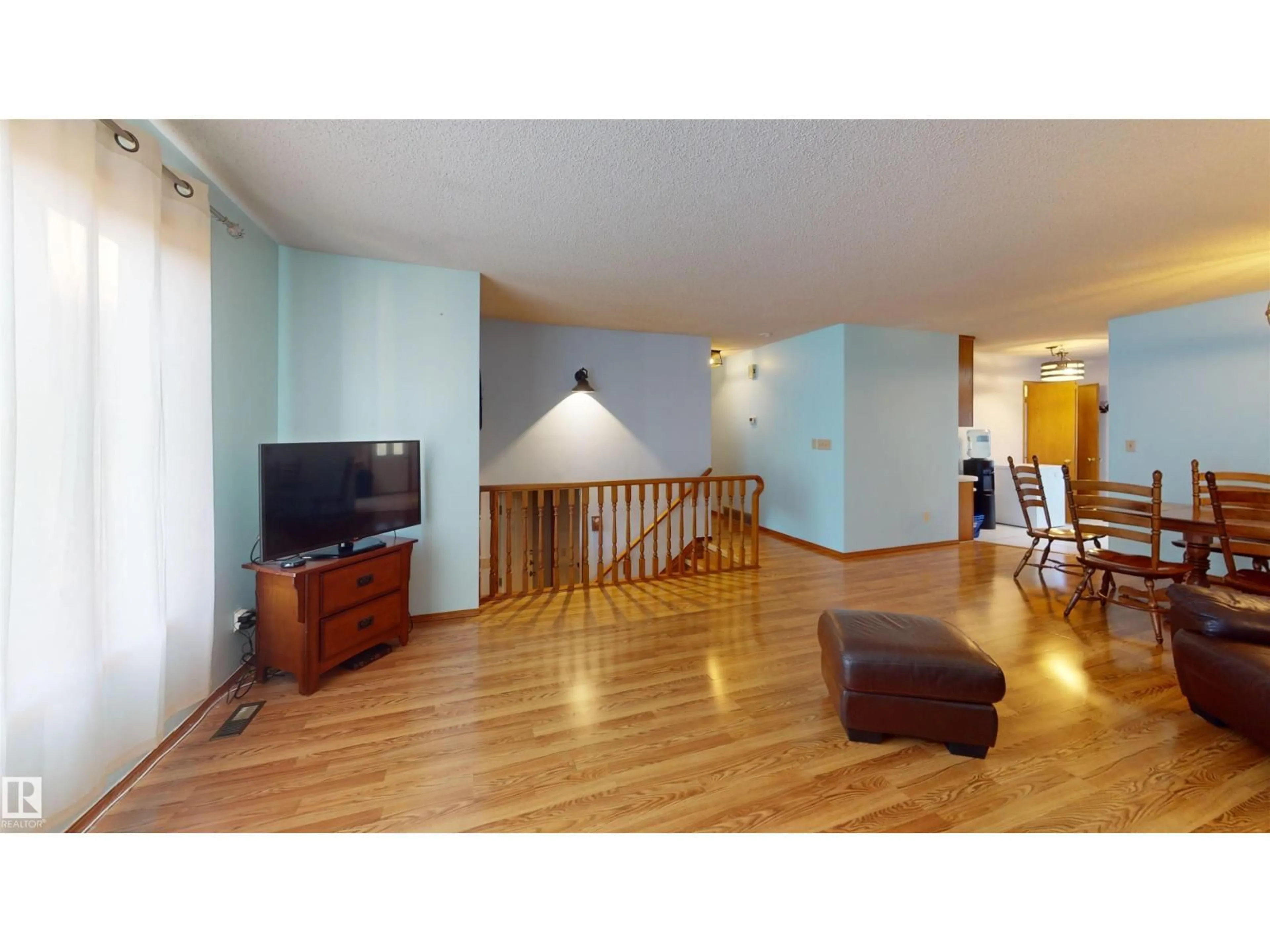 Living room with furniture, wood/laminate floor for 4916 31 AV, Edmonton Alberta T6L5H6