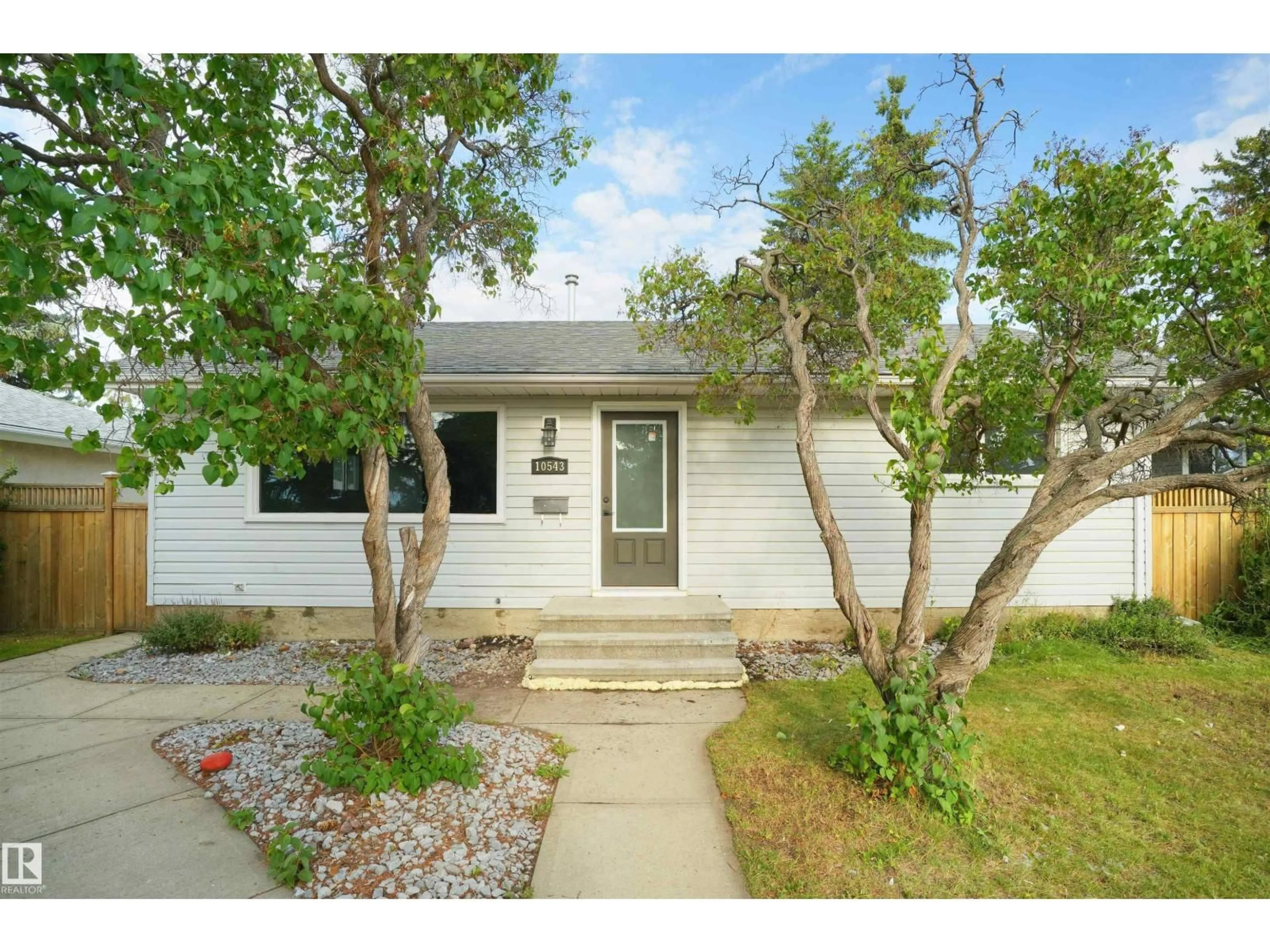 Home with vinyl exterior material, street for NW - 10543 46 ST, Edmonton Alberta T6A1Y4