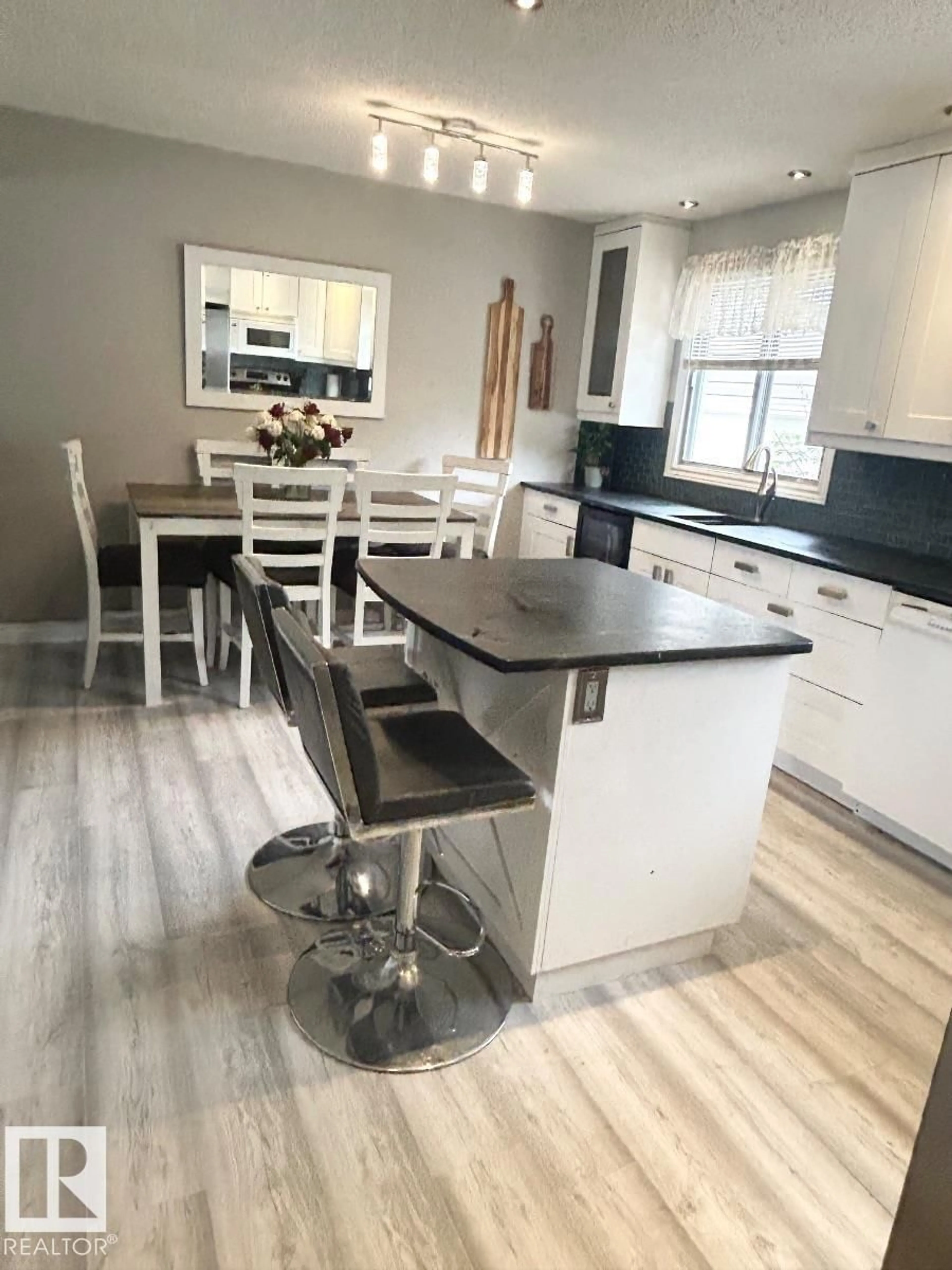 Open concept kitchen, wood/laminate floor for 6420 146 AV, Edmonton Alberta T5A1T3