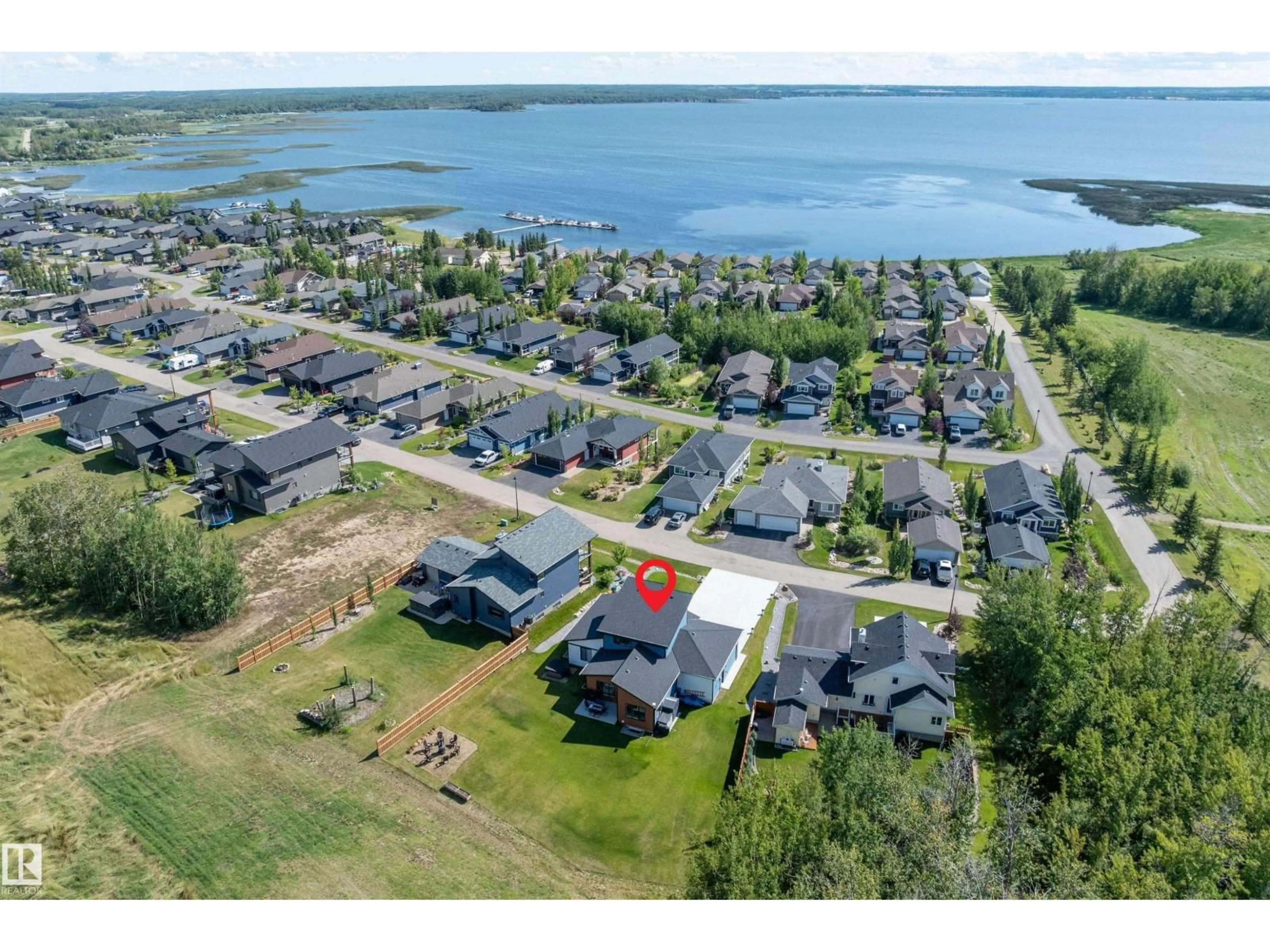 A pic from outside/outdoor area/front of a property/back of a property/a pic from drone, water/lake/river/ocean view for 621 STE. ANNE TR, Rural Lac Ste. Anne County Alberta T0E1A1