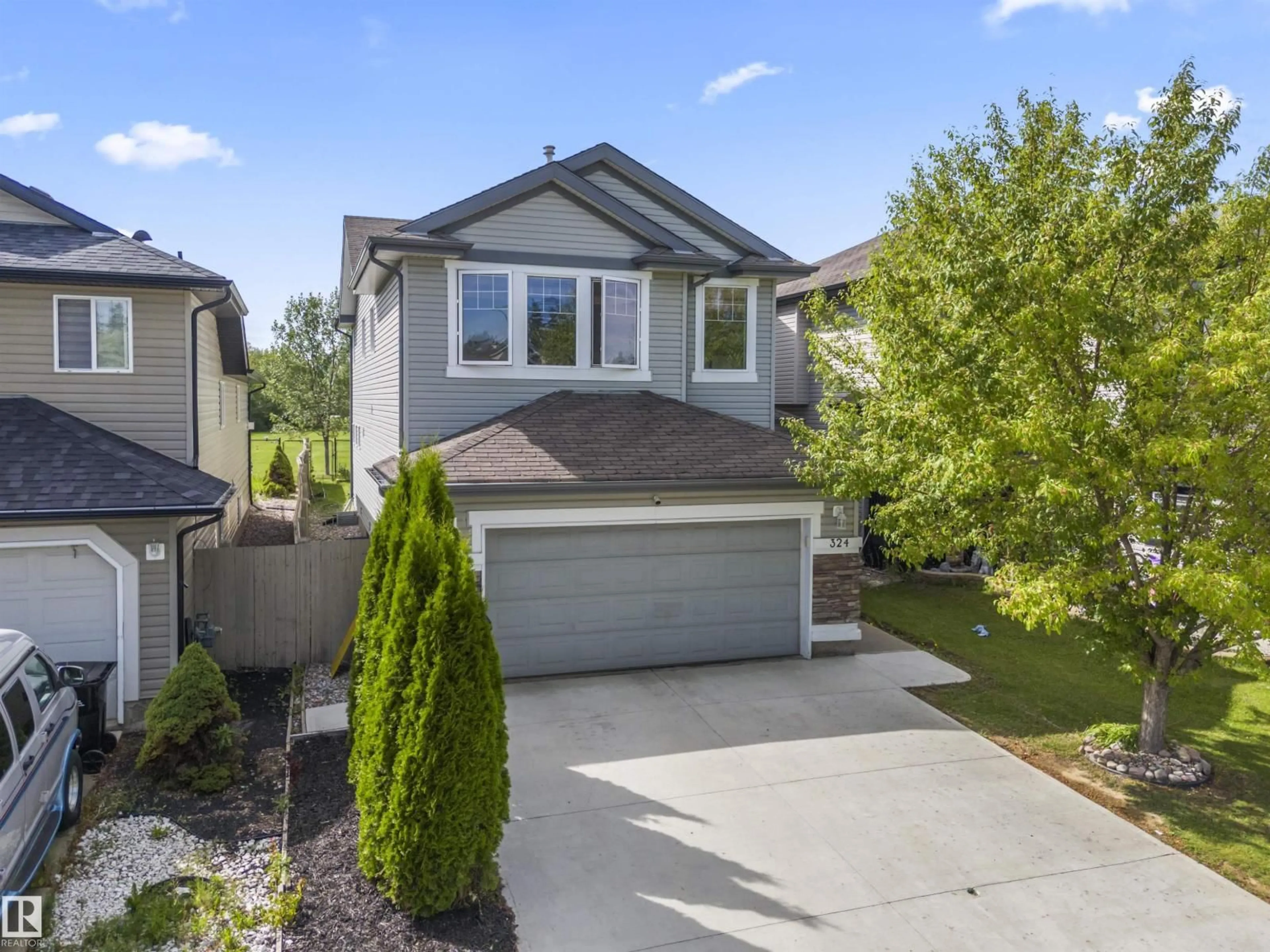 Home with vinyl exterior material, street for SW - 324 79 ST, Edmonton Alberta T6X1N1