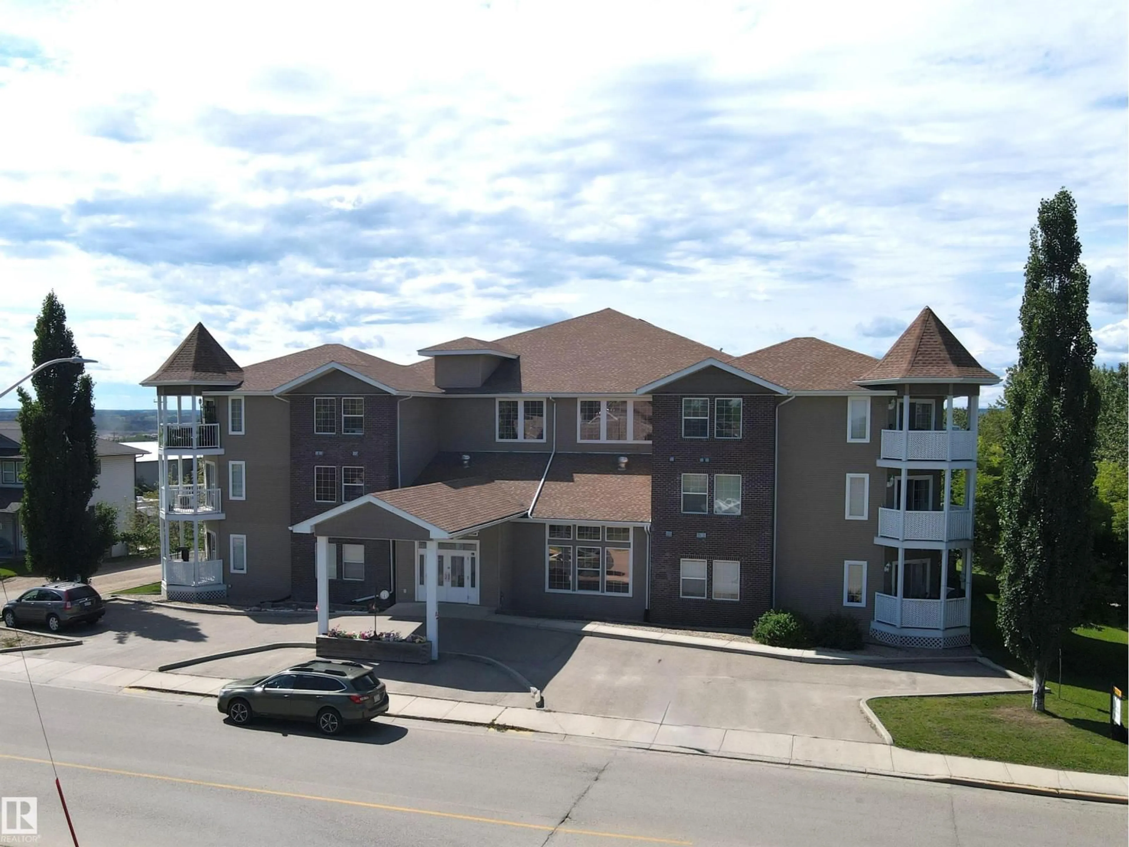 A pic from outside/outdoor area/front of a property/back of a property/a pic from drone, building for 107 - 4128 47 ST, Drayton Valley Alberta T7A0A9