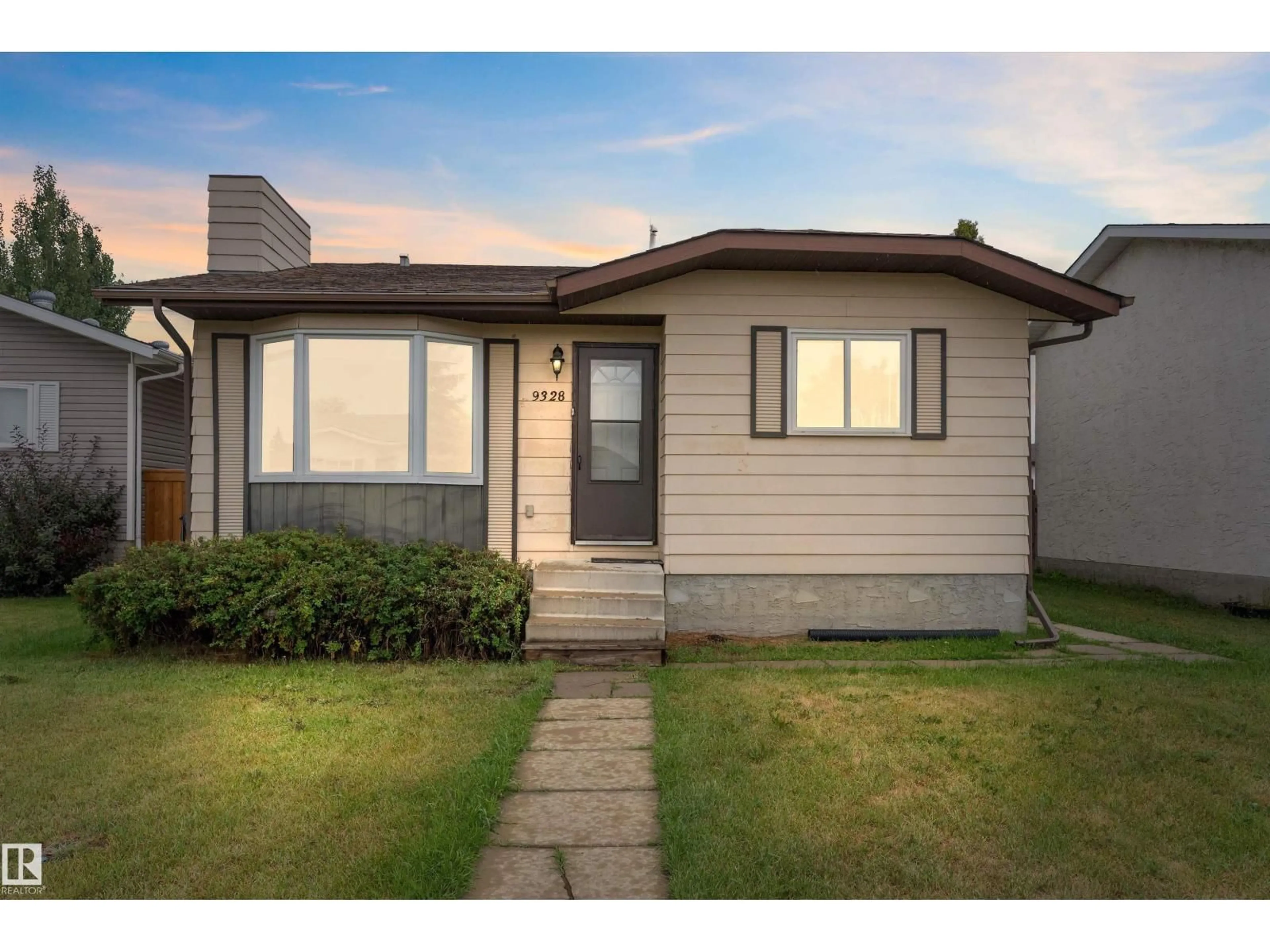 Home with vinyl exterior material, street for NW - 9328 175 AV, Edmonton Alberta T5Z2C5