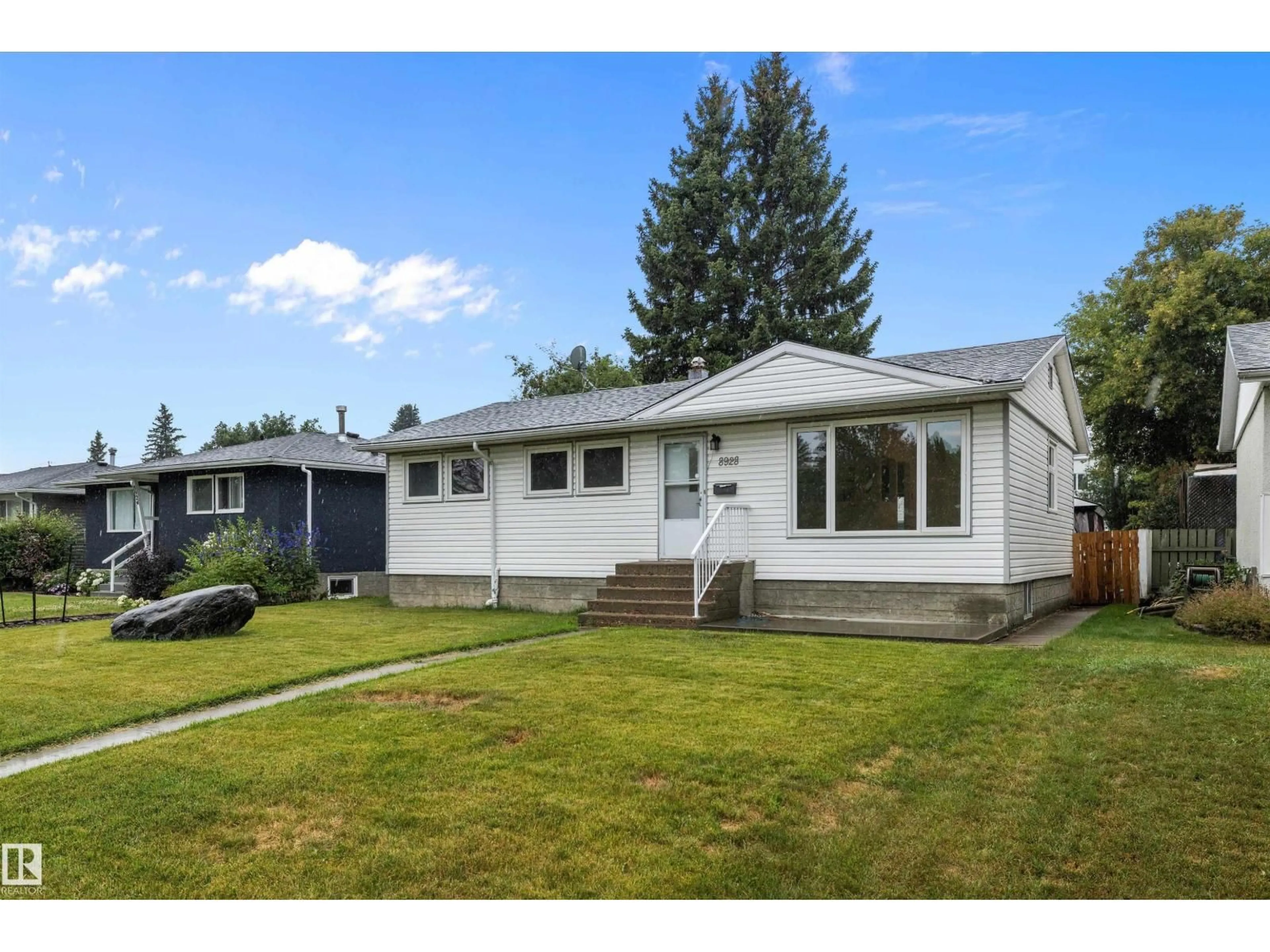 Home with vinyl exterior material, street for 8928 147 ST, Edmonton Alberta T5R0Y3