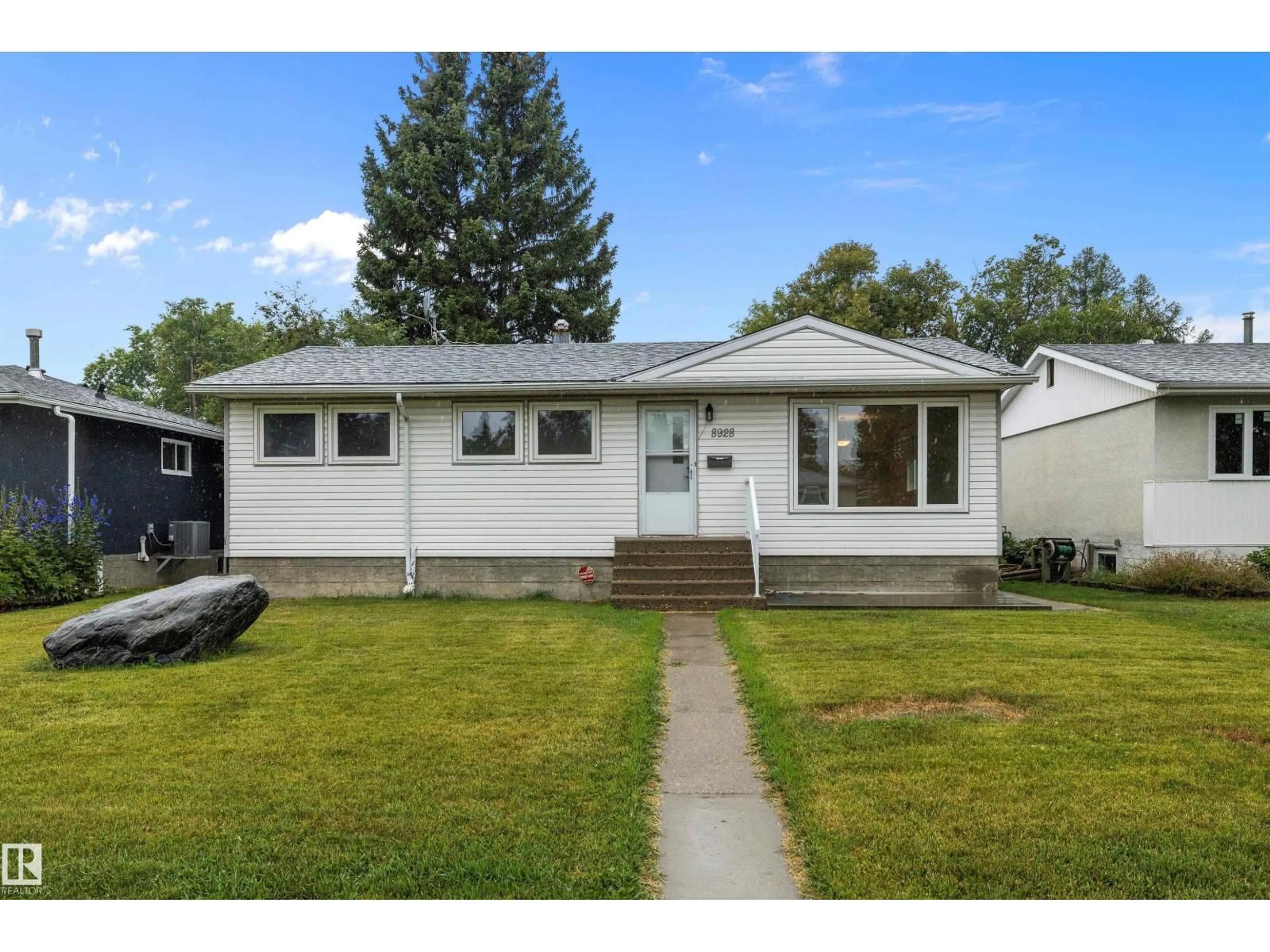 Home with vinyl exterior material, street for 8928 147 ST, Edmonton Alberta T5R0Y3