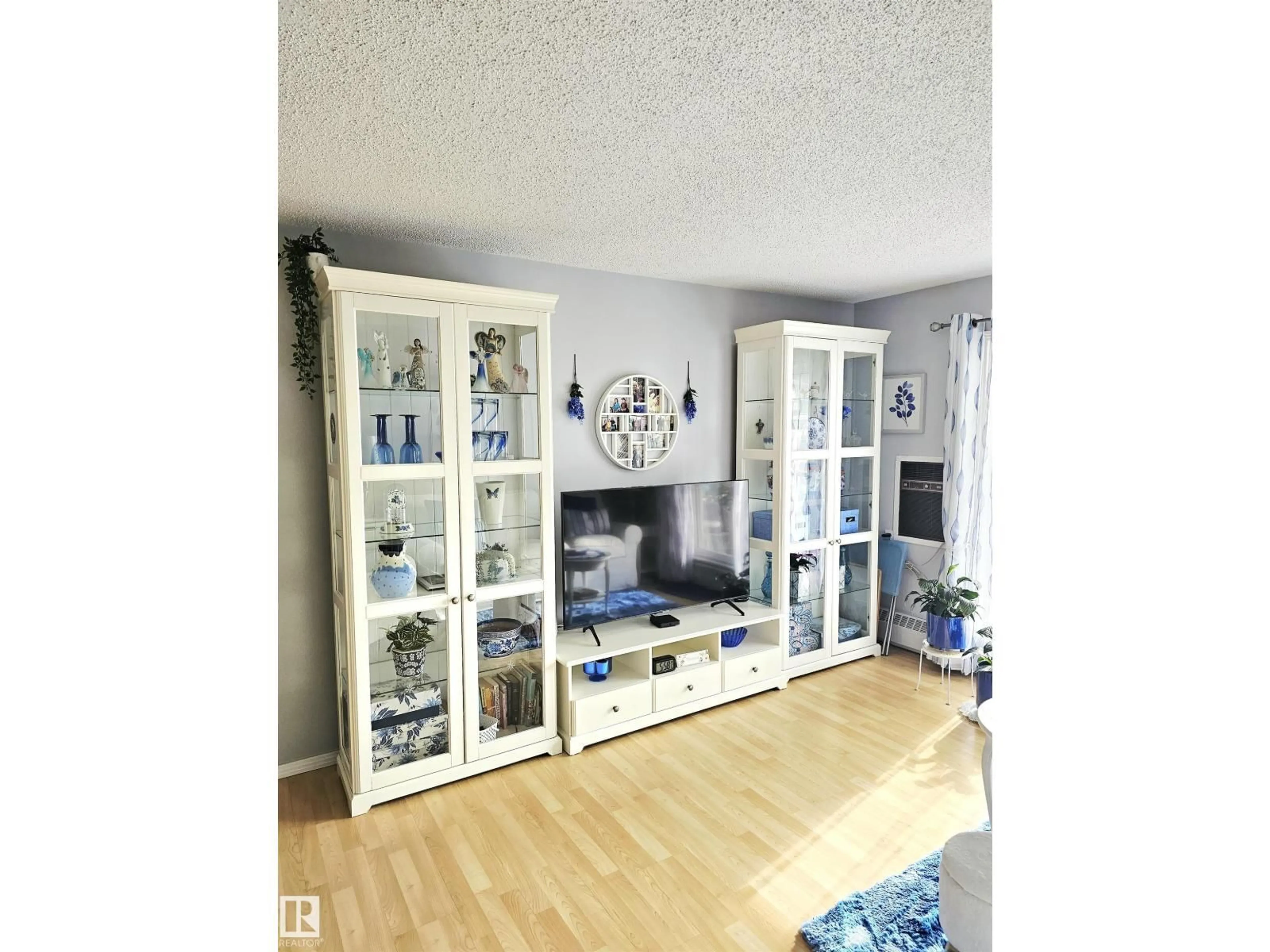 Living room with furniture, wood/laminate floor for #318 - 6710 158 AV, Edmonton Alberta T5Z3A7