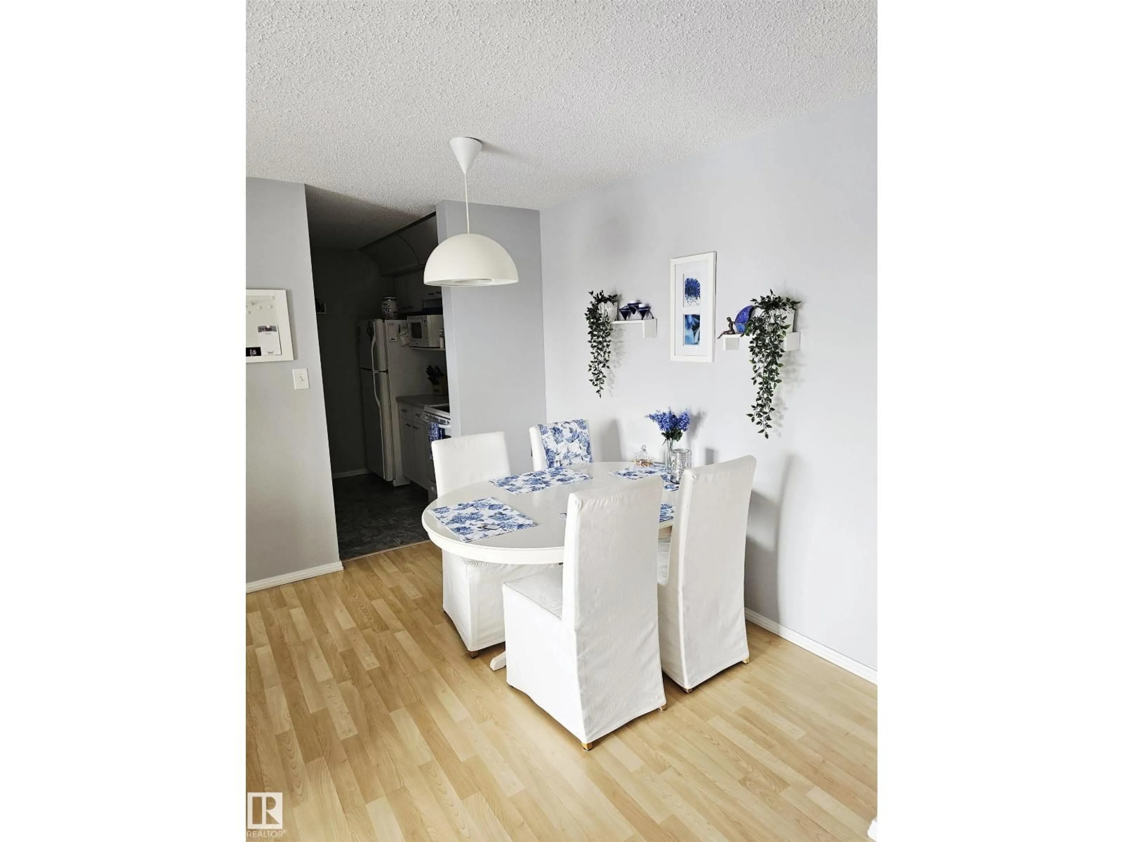 Dining room, wood/laminate floor for #318 - 6710 158 AV, Edmonton Alberta T5Z3A7