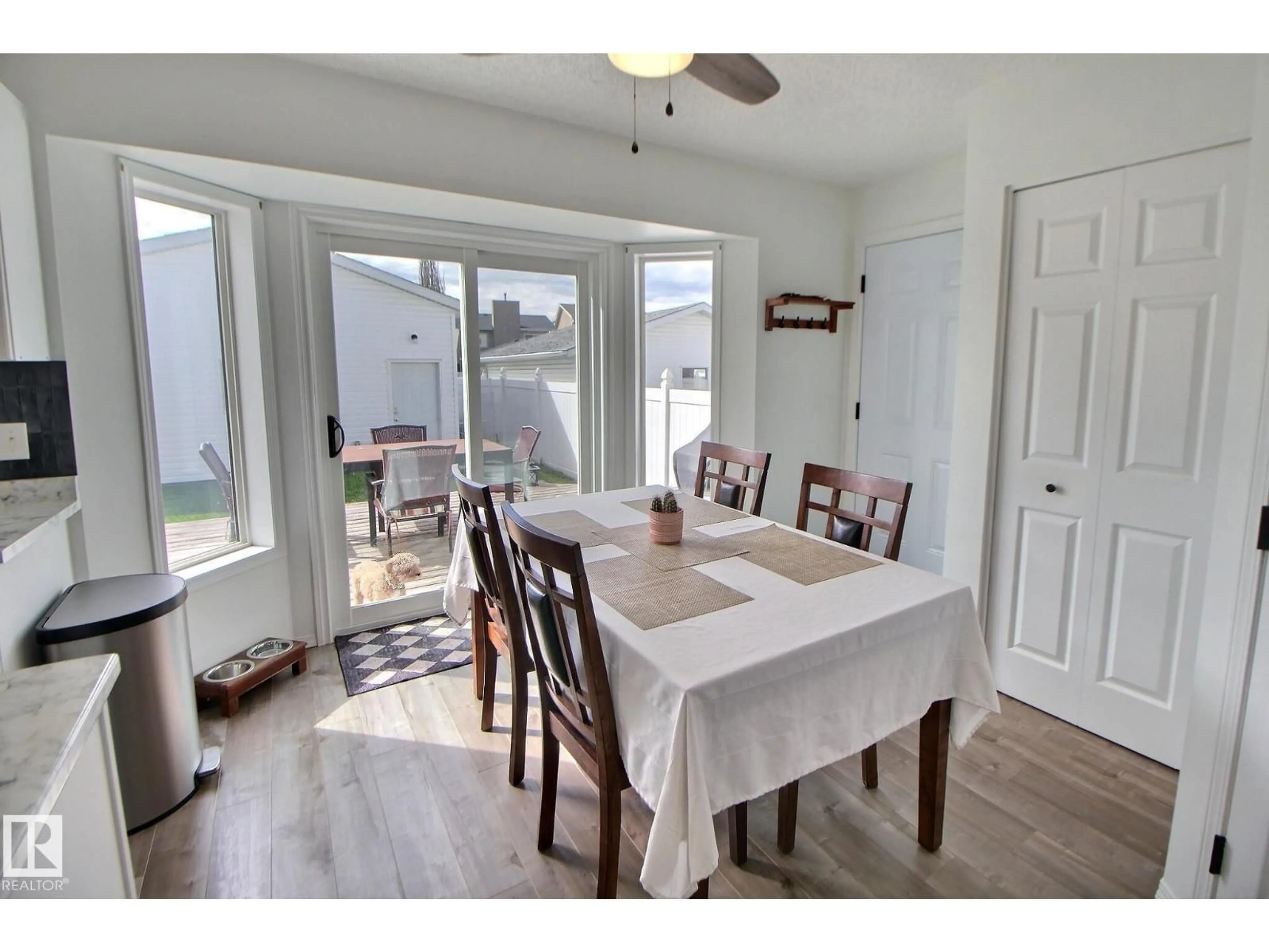 Dining room, wood/laminate floor for 8335 159 AV, Edmonton Alberta T5Z3C8