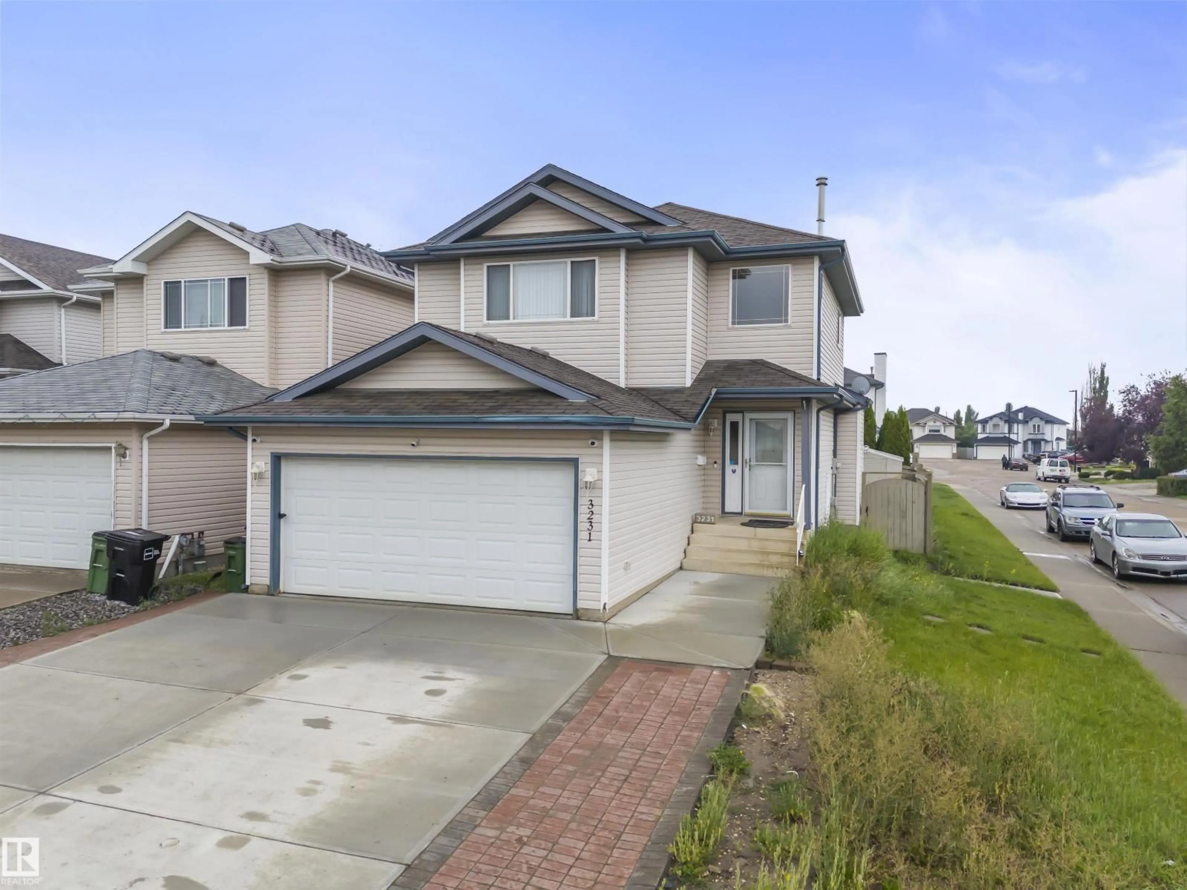 Home with vinyl exterior material, street for 3231 30 AVE NW, Edmonton Alberta T6T1T4