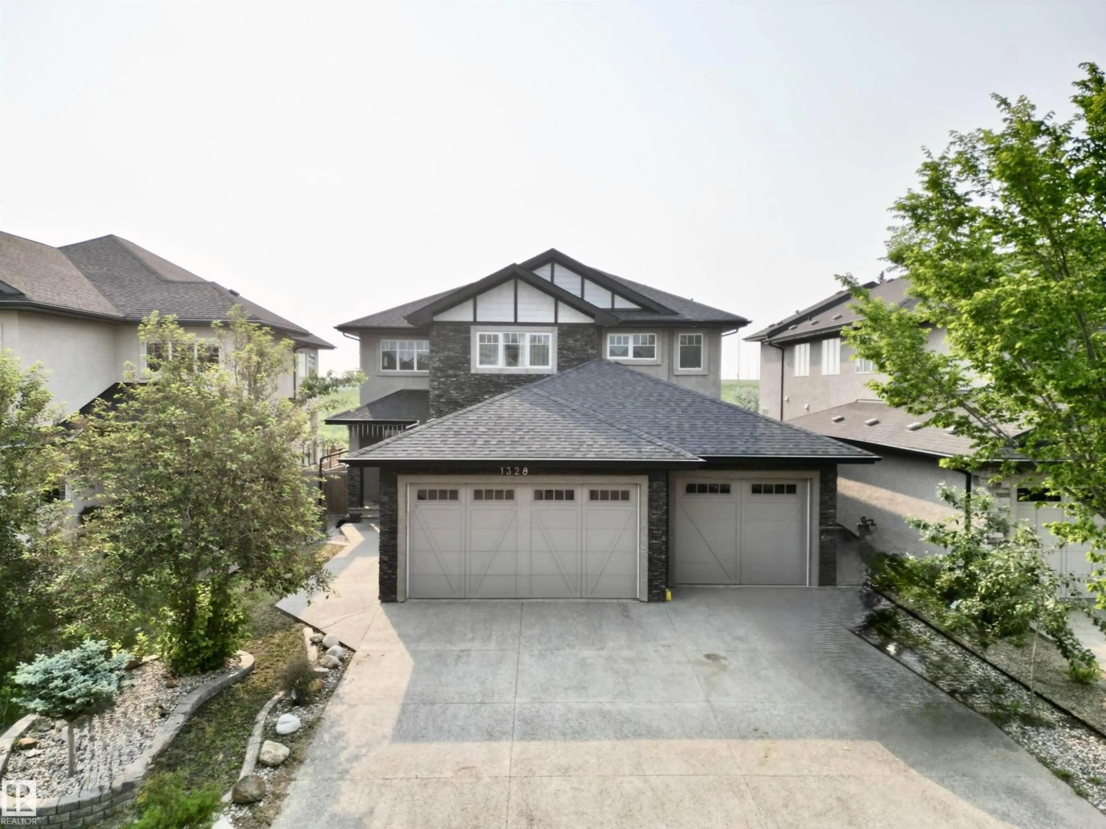 A pic from outside/outdoor area/front of a property/back of a property/a pic from drone, street for 1328 ADAMSON DR, Edmonton Alberta T6W1A8