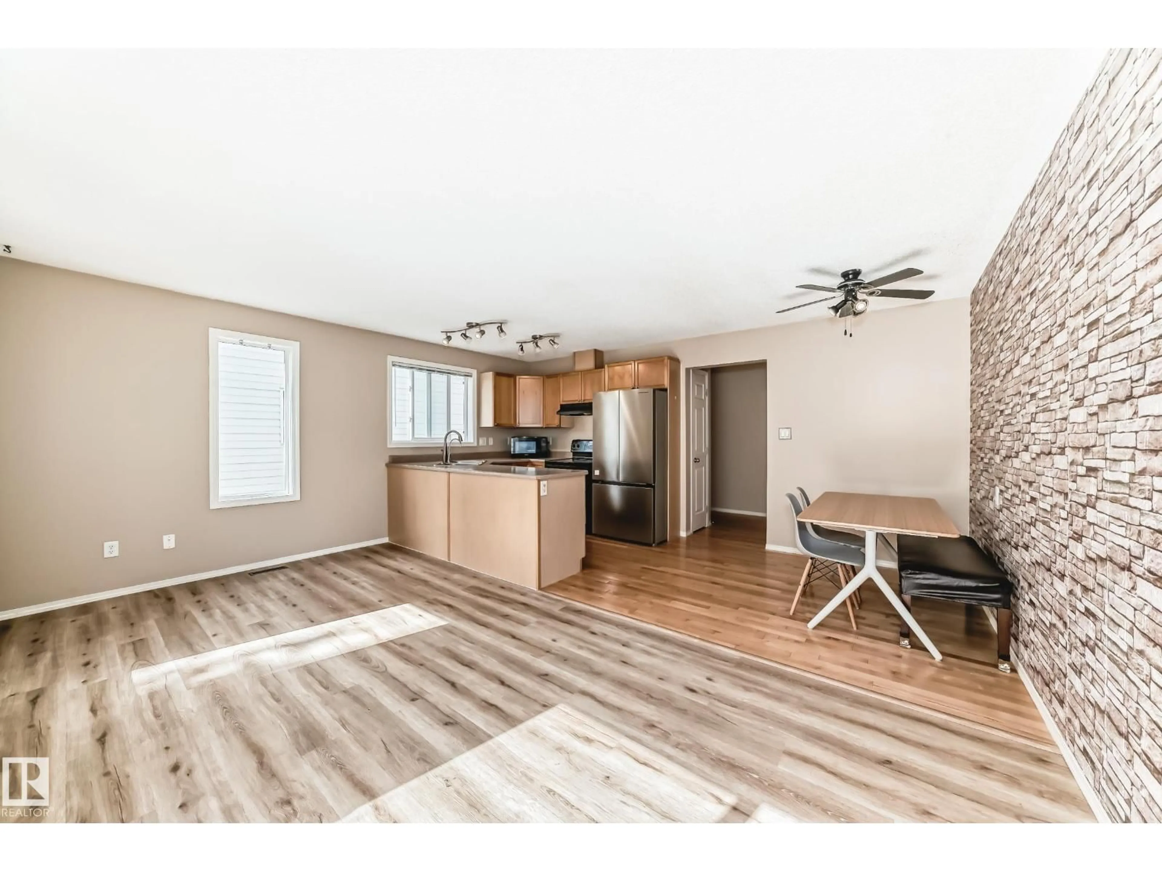 Open concept kitchen, wood/laminate floor for 451 - 46 HYNDMAN CRESCENT, Edmonton Alberta T5A5J3