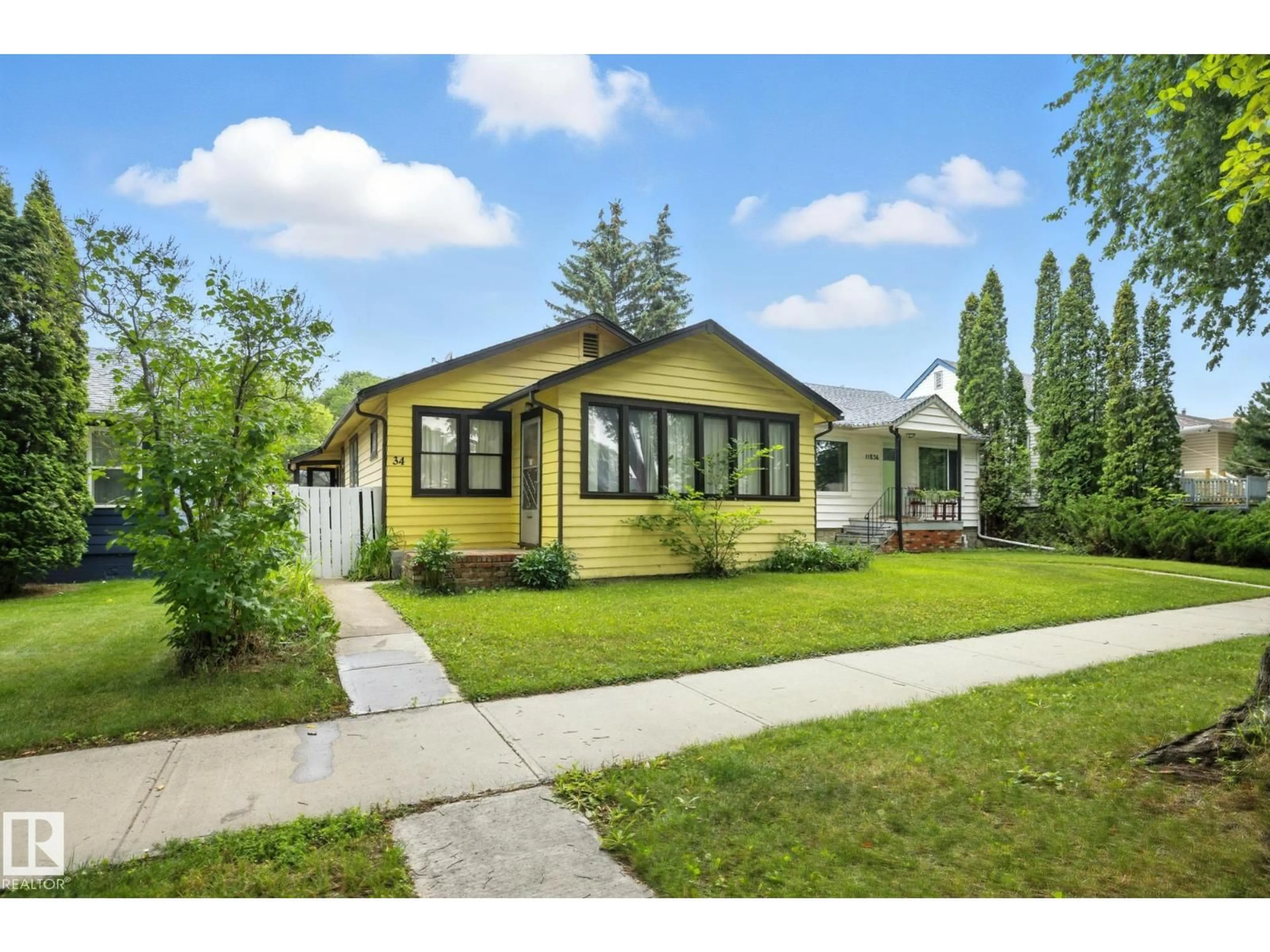Home with vinyl exterior material, street for NW - 11834 69 ST, Edmonton Alberta T5E2H8