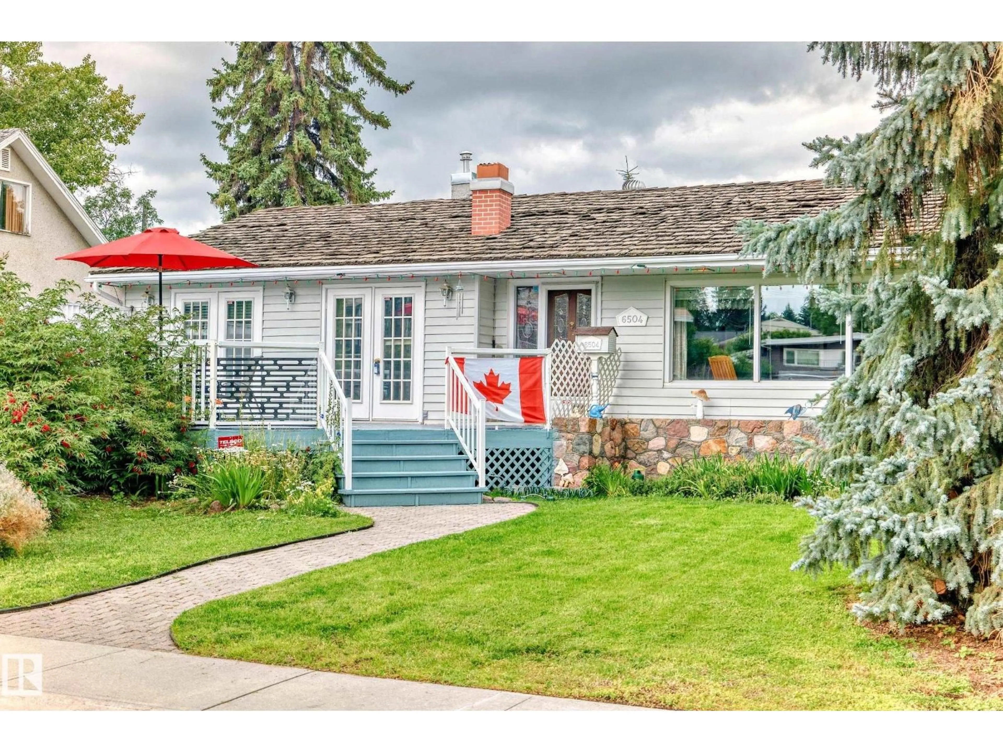 Home with vinyl exterior material, street for 6504 109B AV NW, Edmonton Alberta T6A1S8