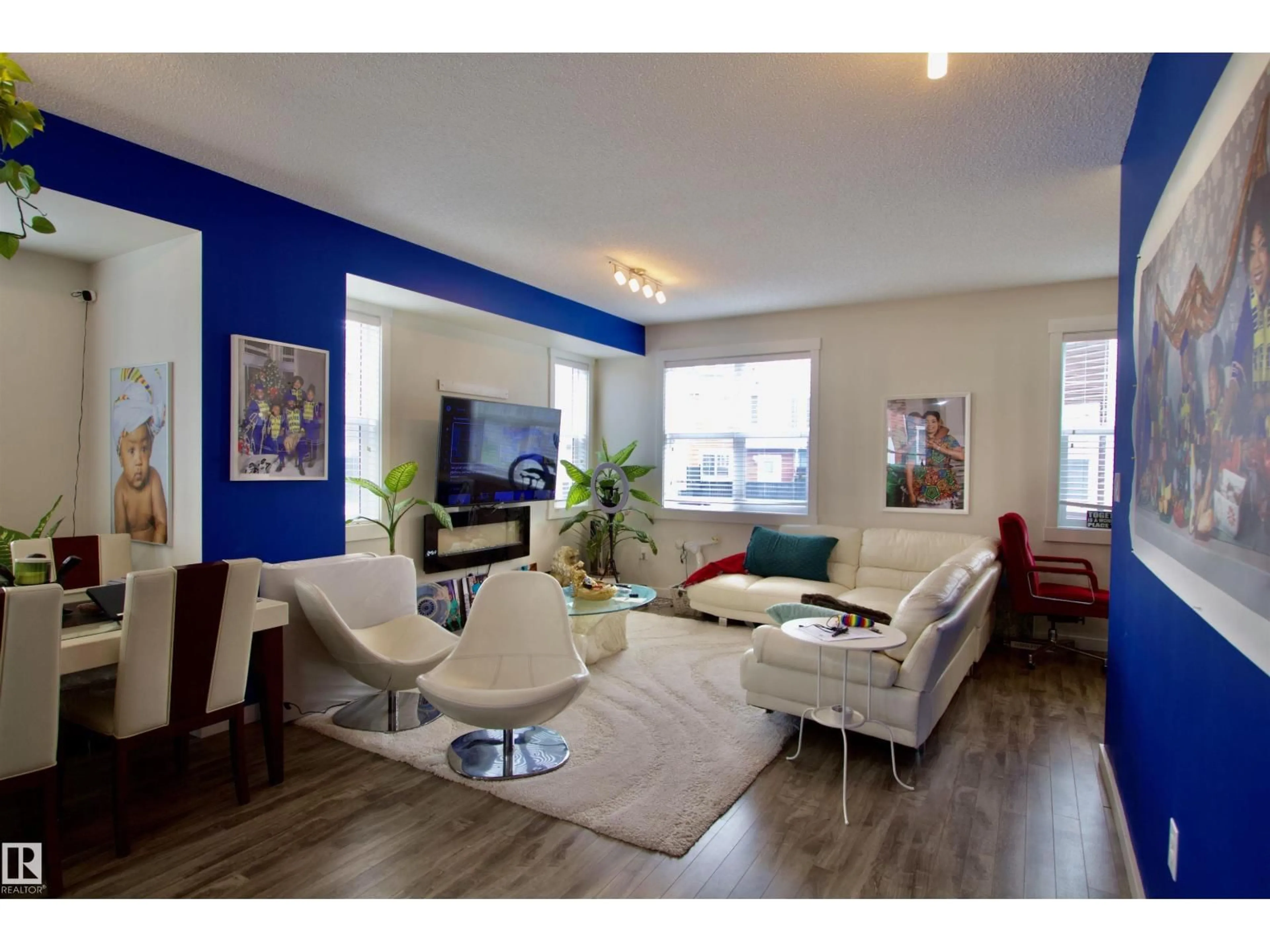 Living room with furniture, wood/laminate floor for 903 - 96 CRYSTALLINA NERA WY, Edmonton Alberta T5X0L6