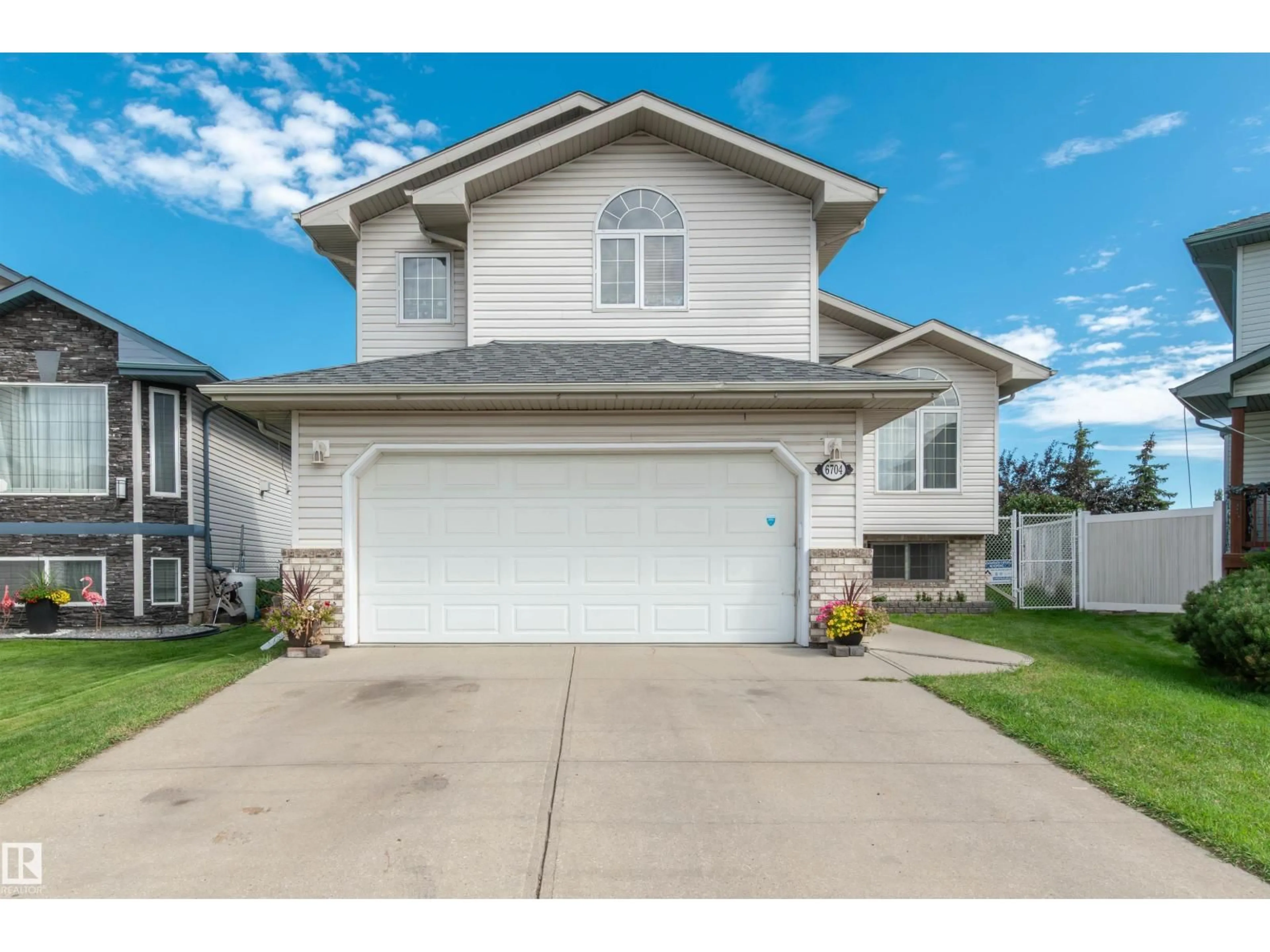 Home with vinyl exterior material, street for 6704 166 AV, Edmonton Alberta T5Z3P7