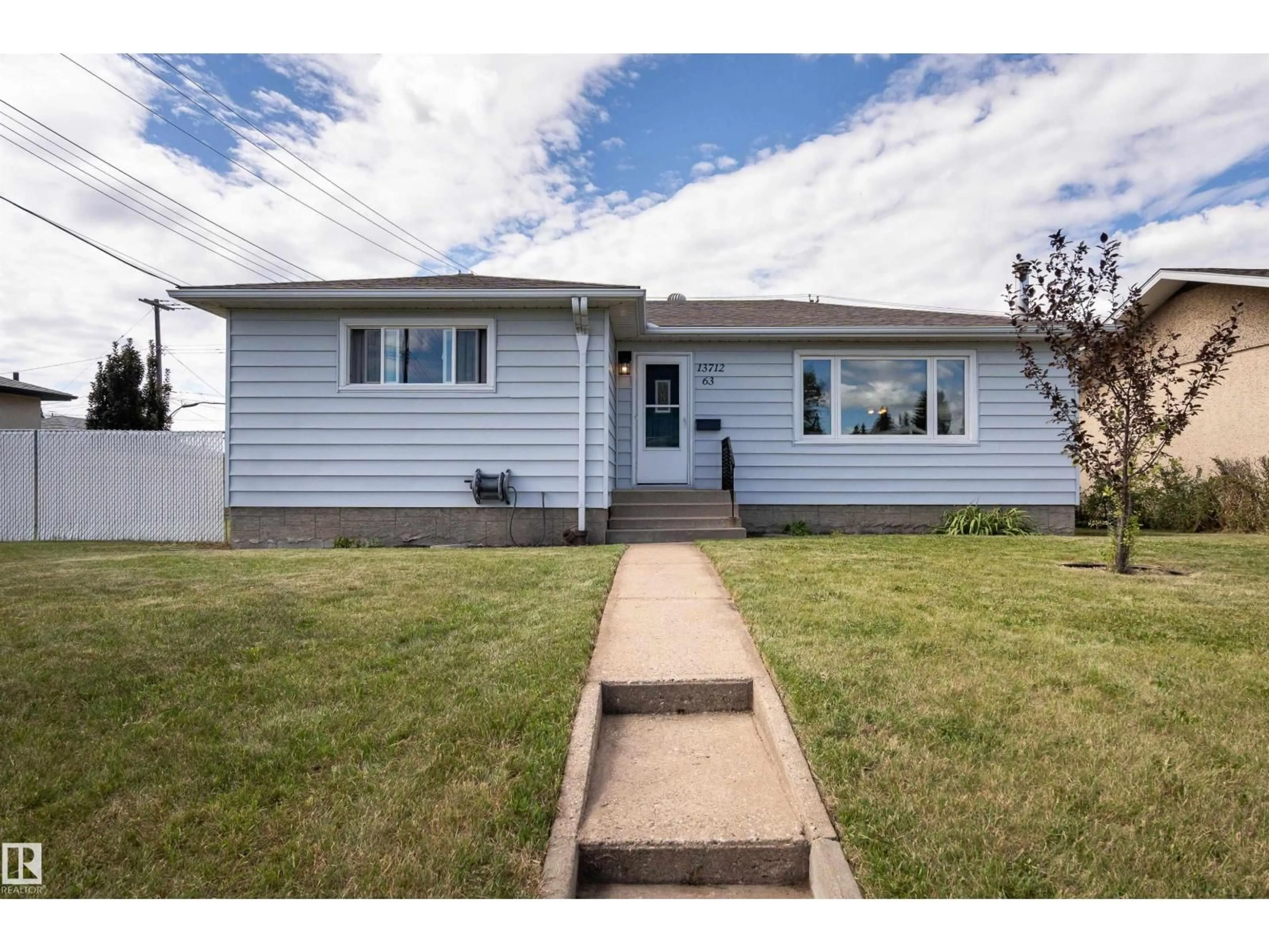 Home with vinyl exterior material, street for 13712 63 ST, Edmonton Alberta T5R1R3