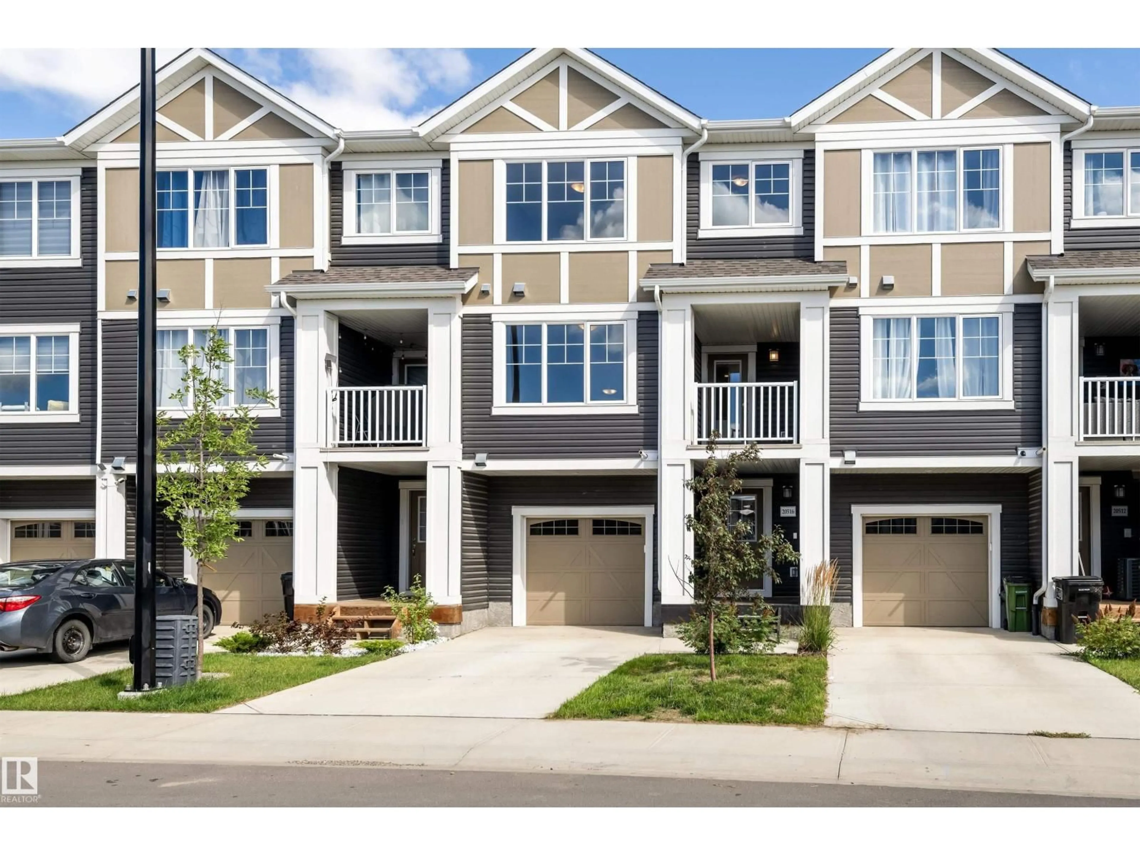Home with vinyl exterior material, street for NW - 20516 21 AV, Edmonton Alberta T6M1M8
