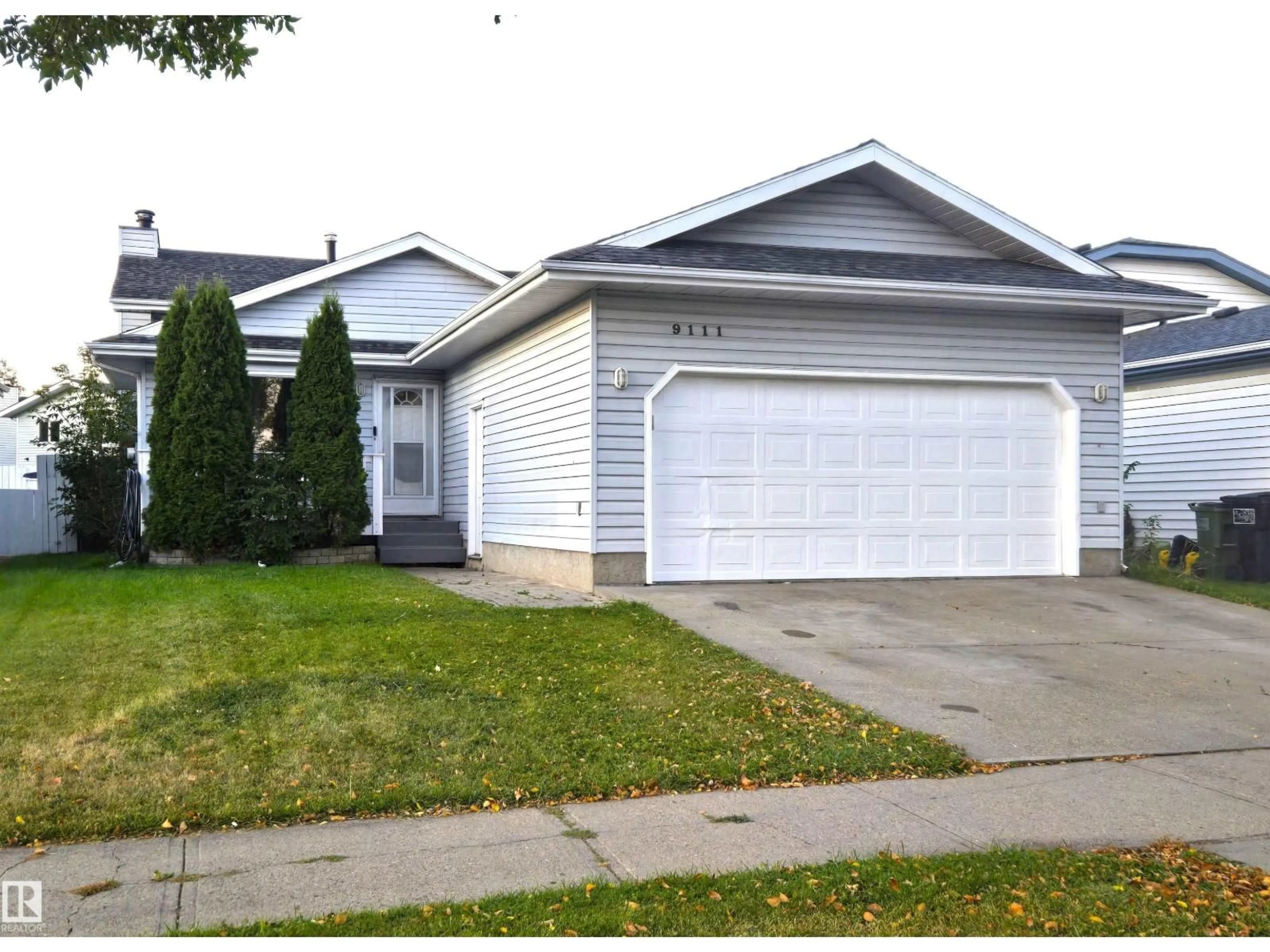 Home with vinyl exterior material, street for 9111 168 AV, Edmonton Alberta T5Z2W1