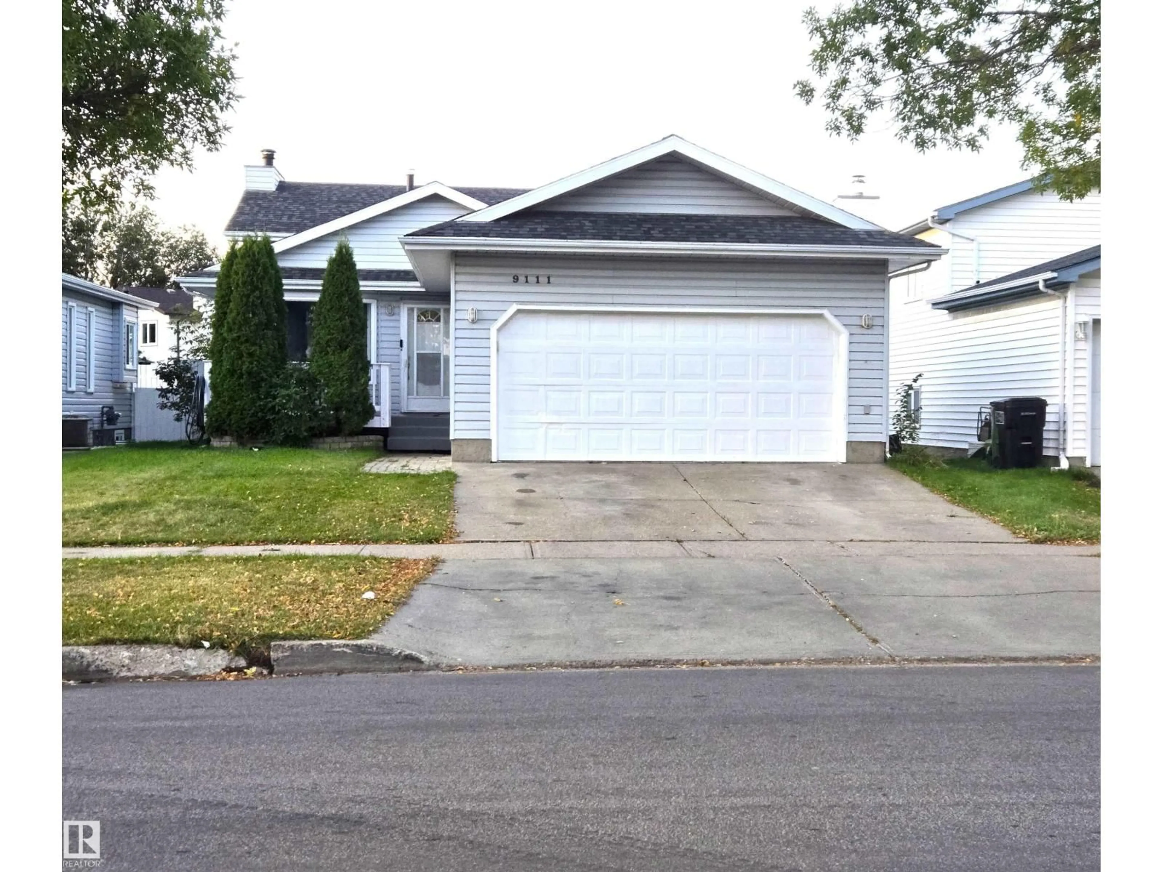 Home with vinyl exterior material, street for 9111 168 AV, Edmonton Alberta T5Z2W1