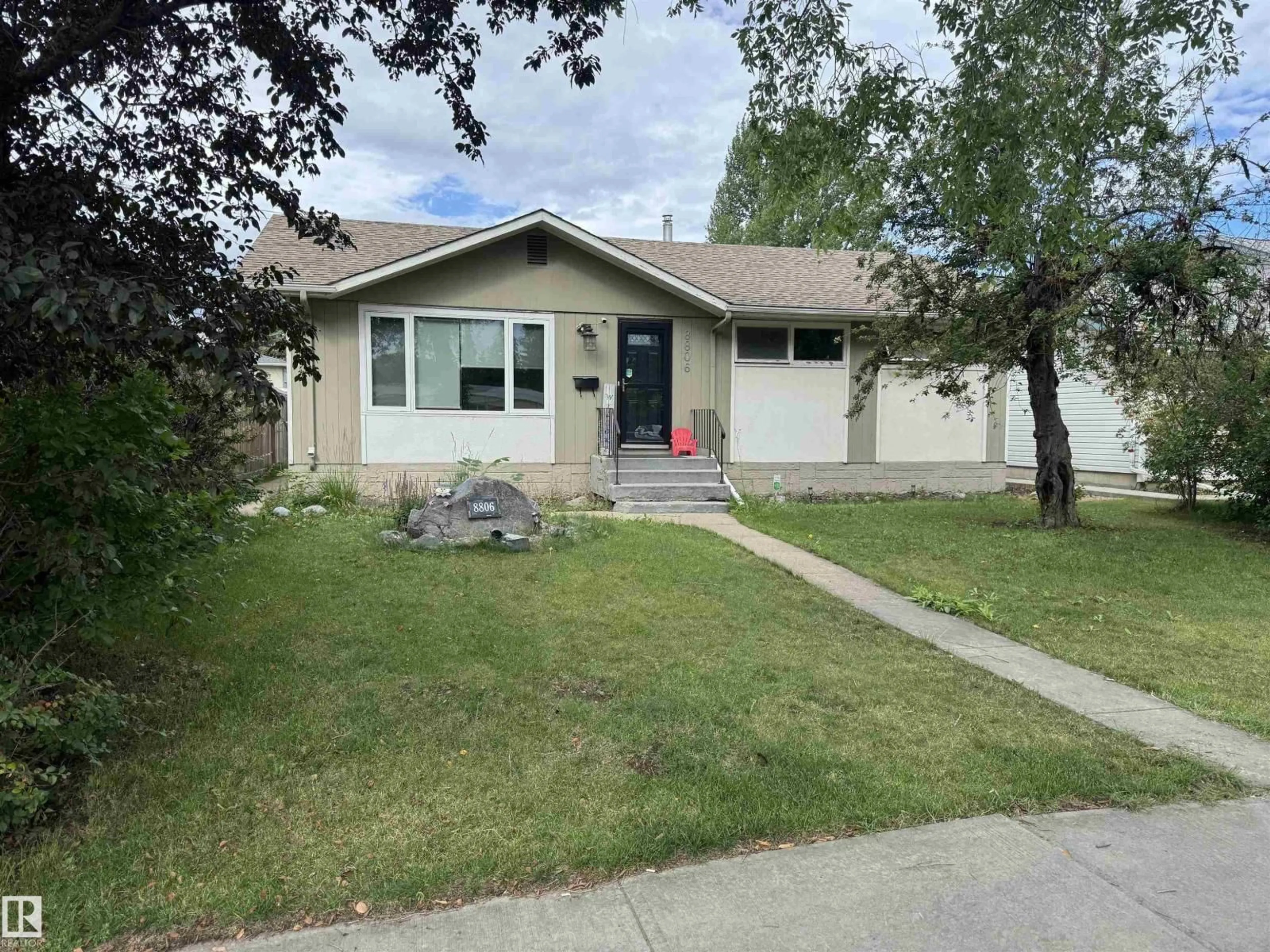 Home with vinyl exterior material, street for 8806 168 ST, Edmonton Alberta T5R2V5