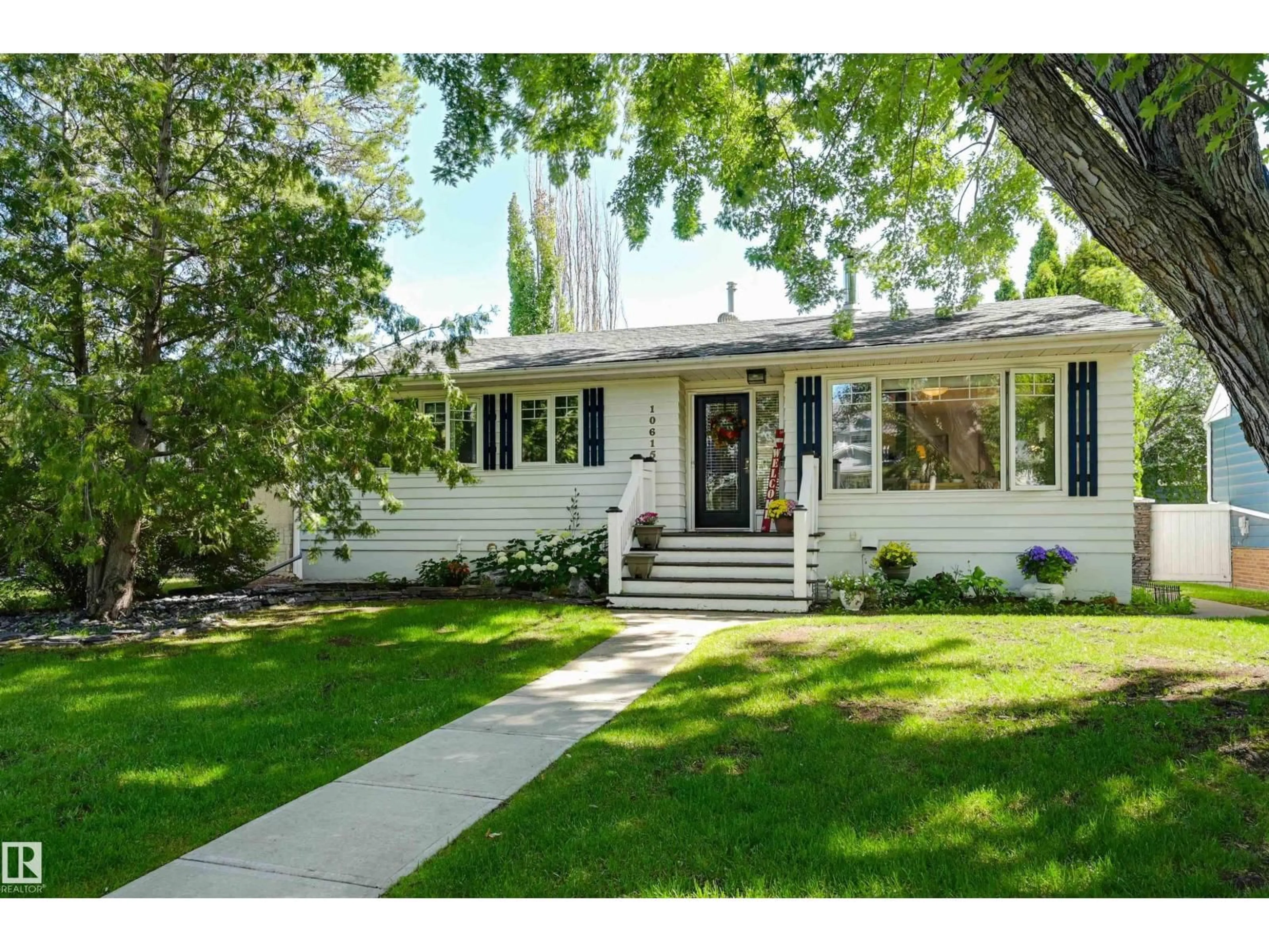 Home with vinyl exterior material, street for NW - 10615 134 ST, Edmonton Alberta T5N2B7