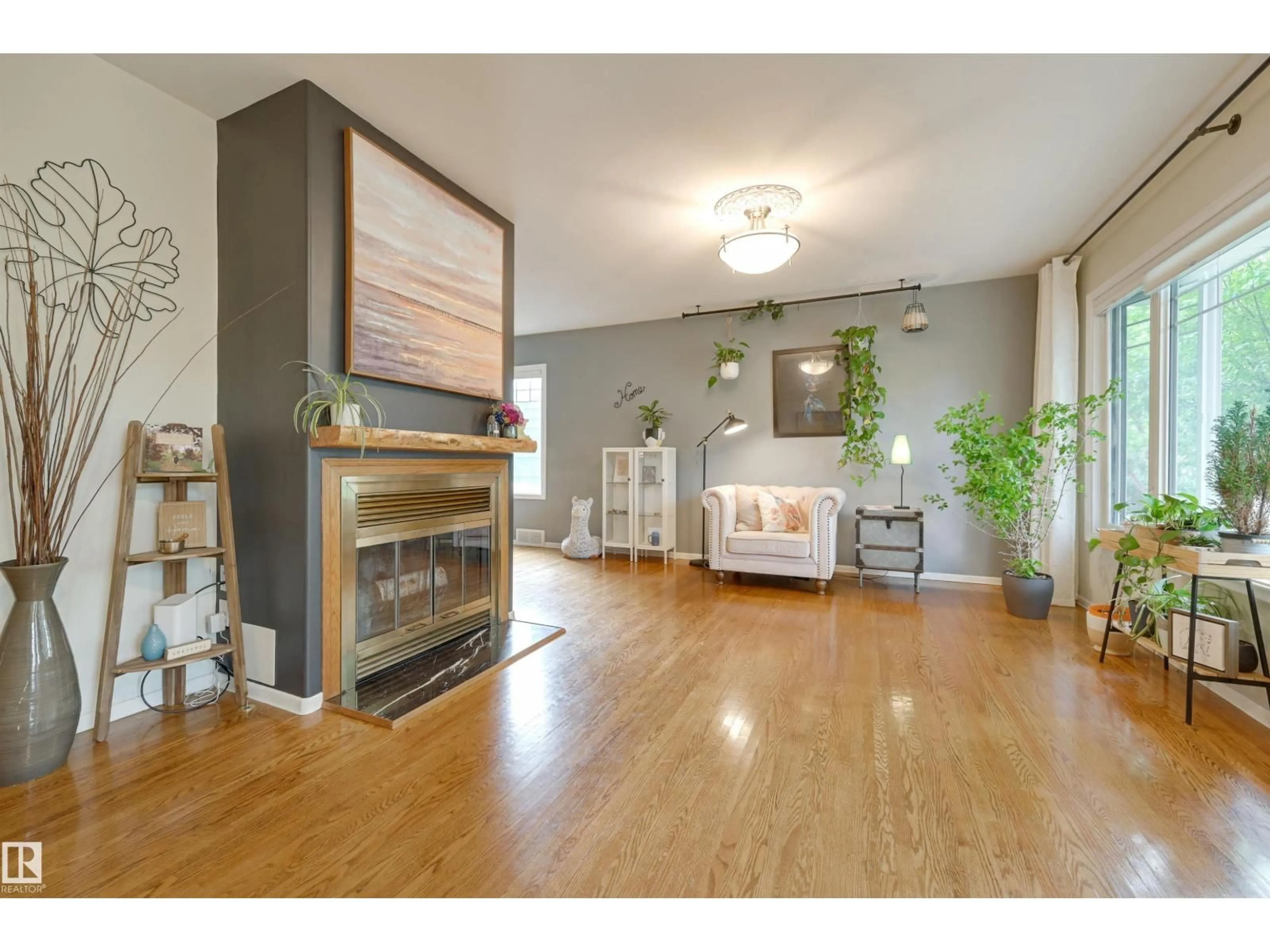 Living room with furniture, wood/laminate floor for NW - 10615 134 ST, Edmonton Alberta T5N2B7