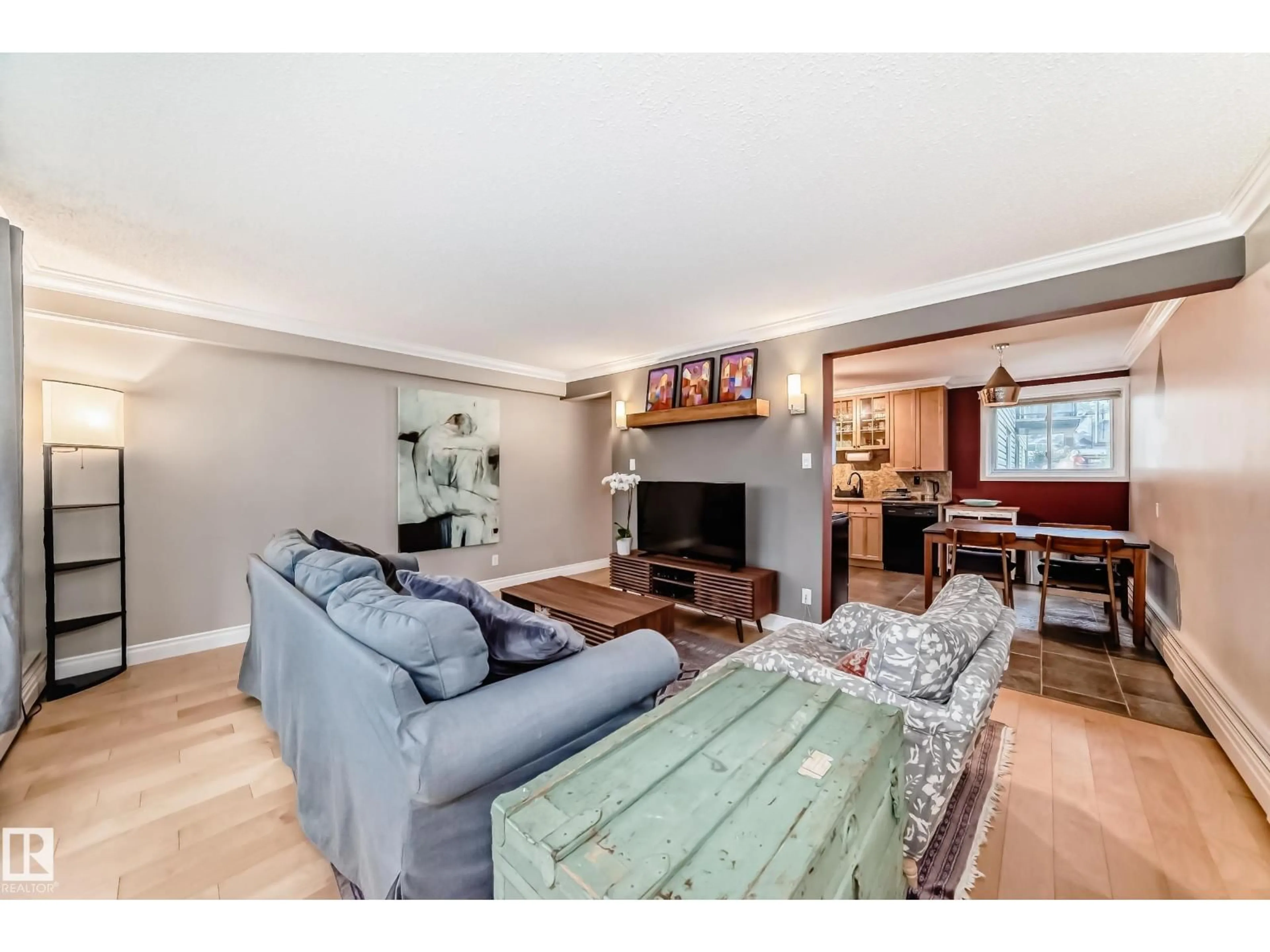 Living room with furniture, wood/laminate floor for #105 - 10745 83 AV, Edmonton Alberta T6E2E5