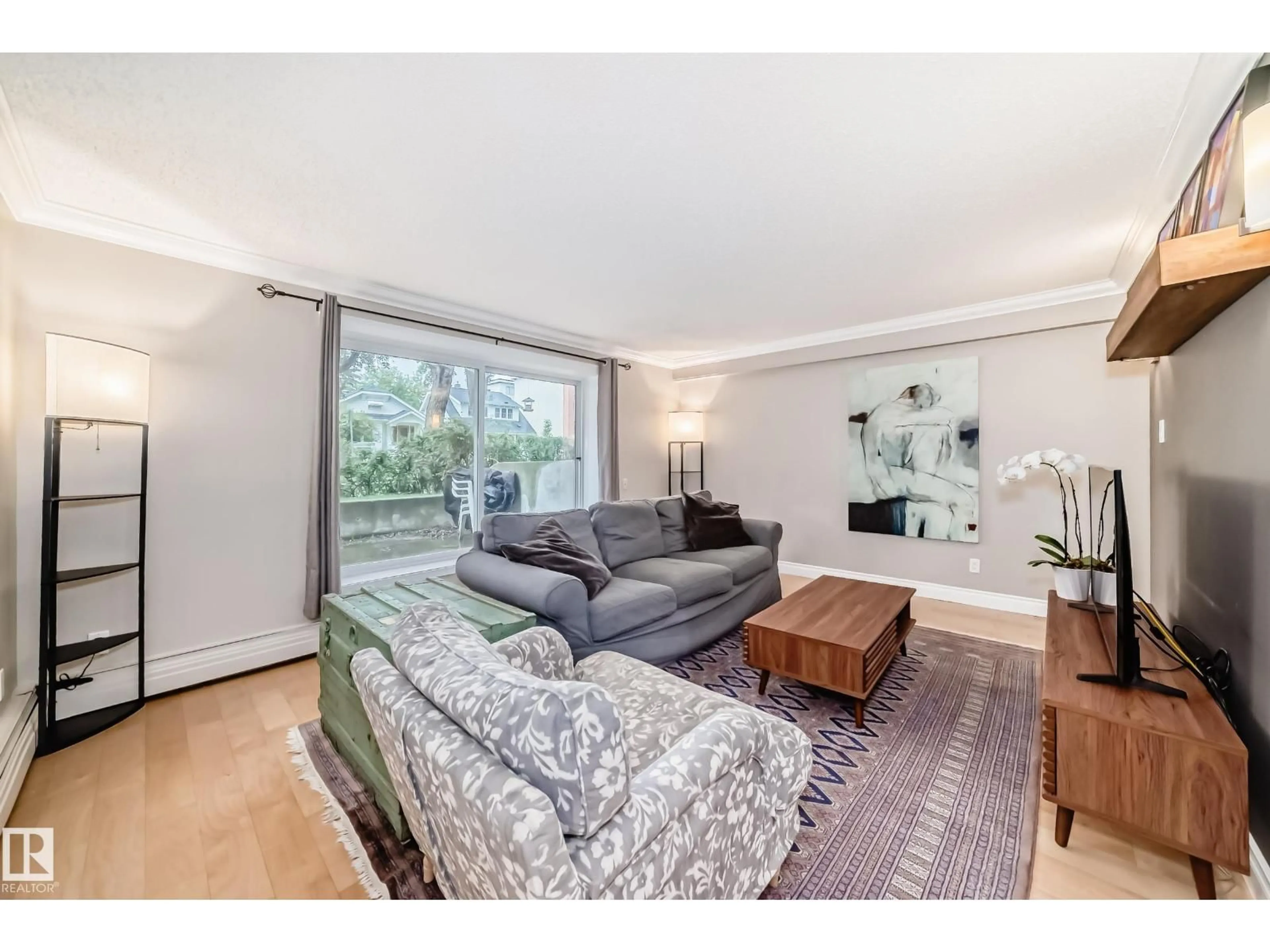Living room with furniture, wood/laminate floor for #105 - 10745 83 AV, Edmonton Alberta T6E2E5