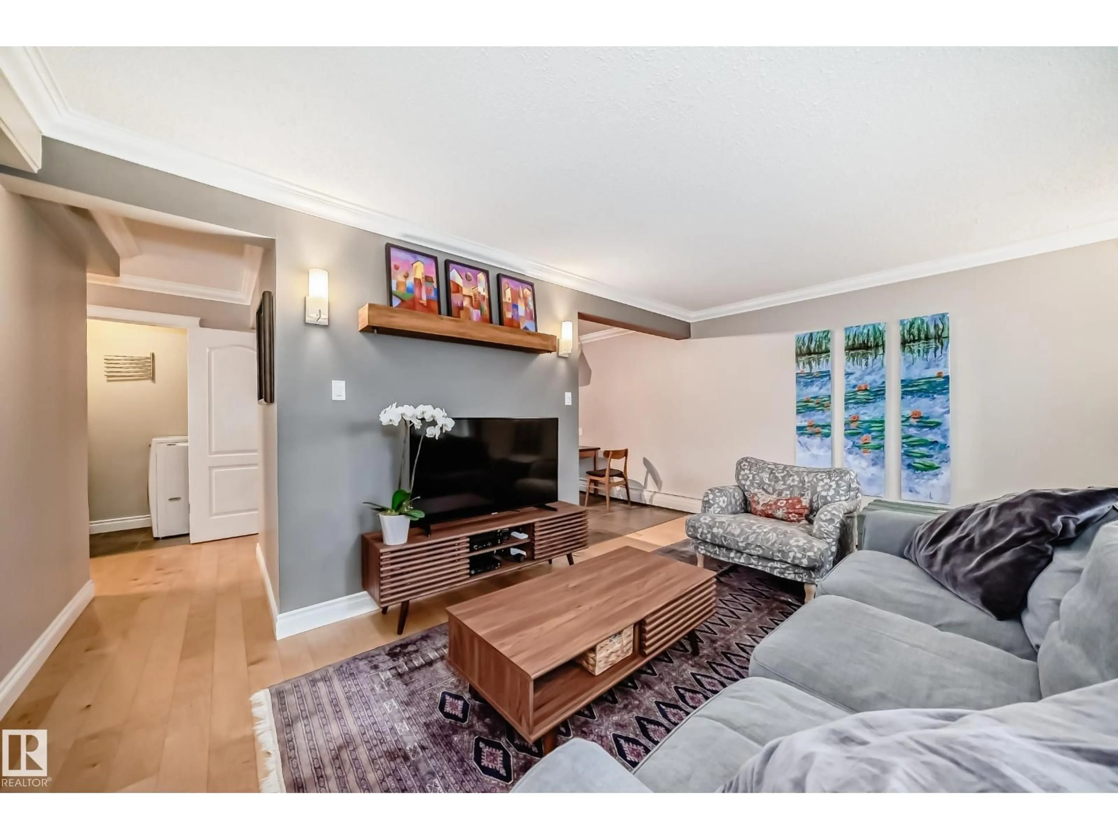 Living room with furniture, wood/laminate floor for #105 - 10745 83 AV, Edmonton Alberta T6E2E5