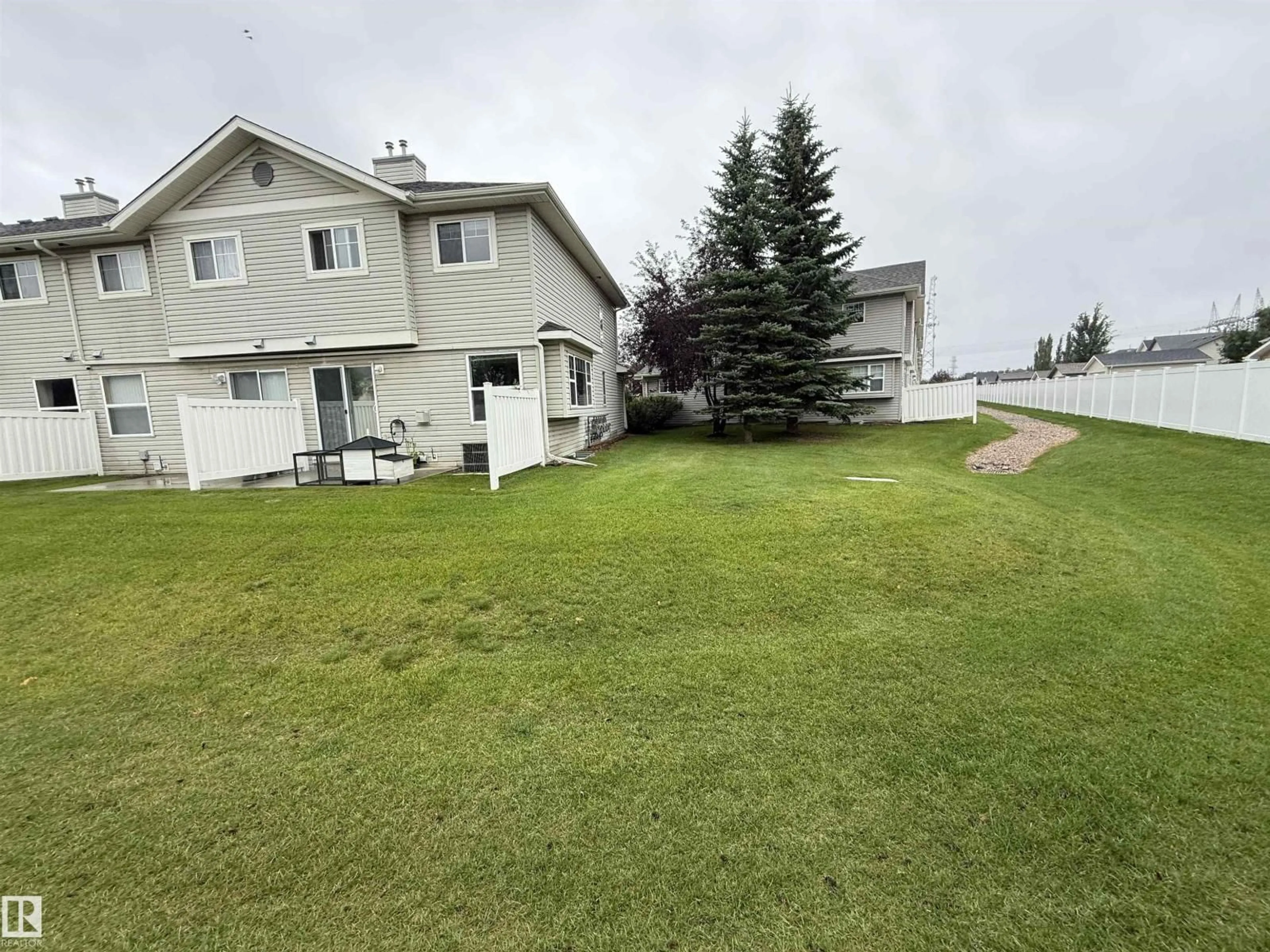 A pic from outside/outdoor area/front of a property/back of a property/a pic from drone, water/lake/river/ocean view for #6 - 230 EDWARDS DR, Edmonton Alberta T6X1G7