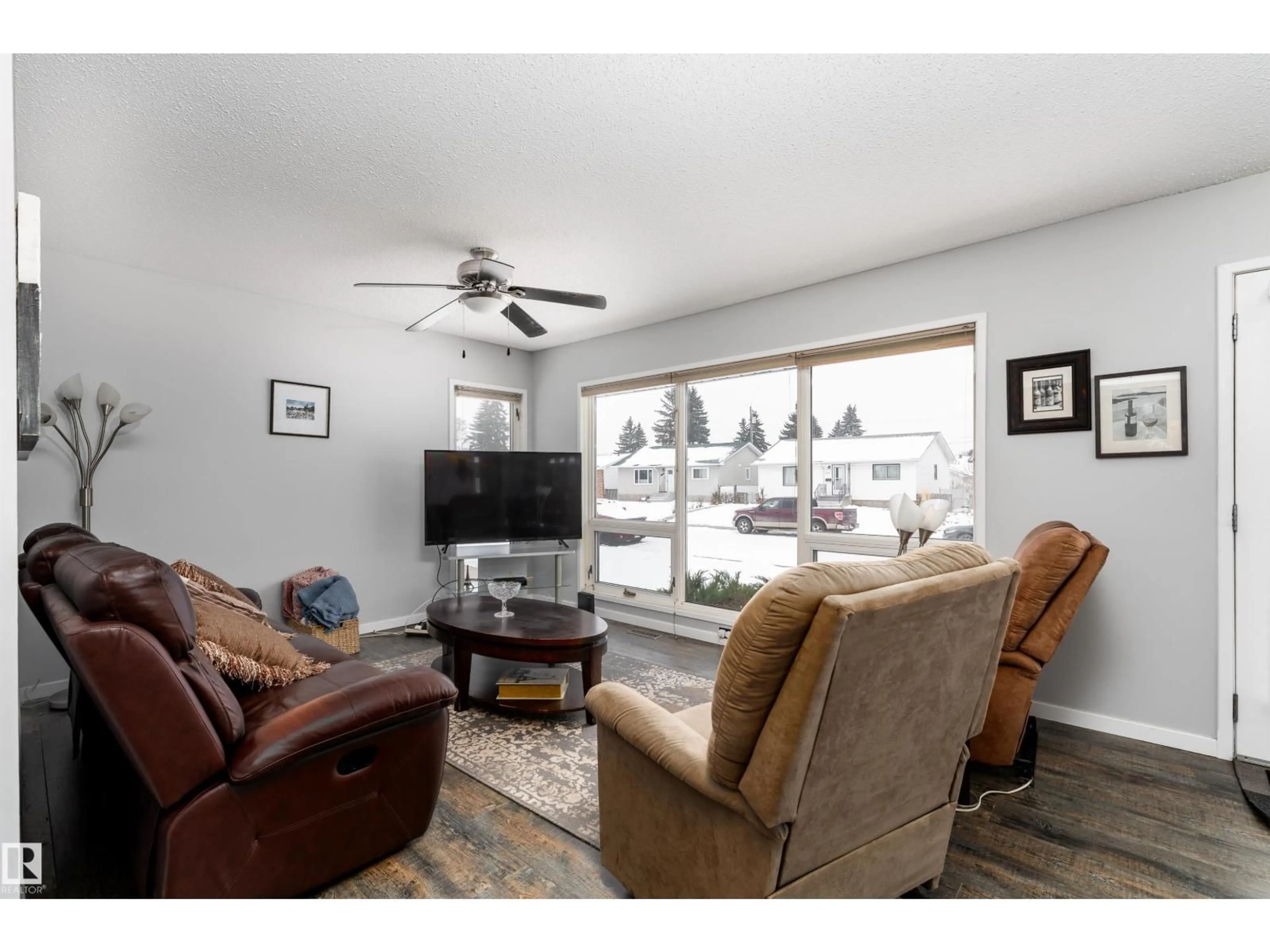 Living room with furniture, wood/laminate floor for 10579 40 ST, Edmonton Alberta T6A1S9
