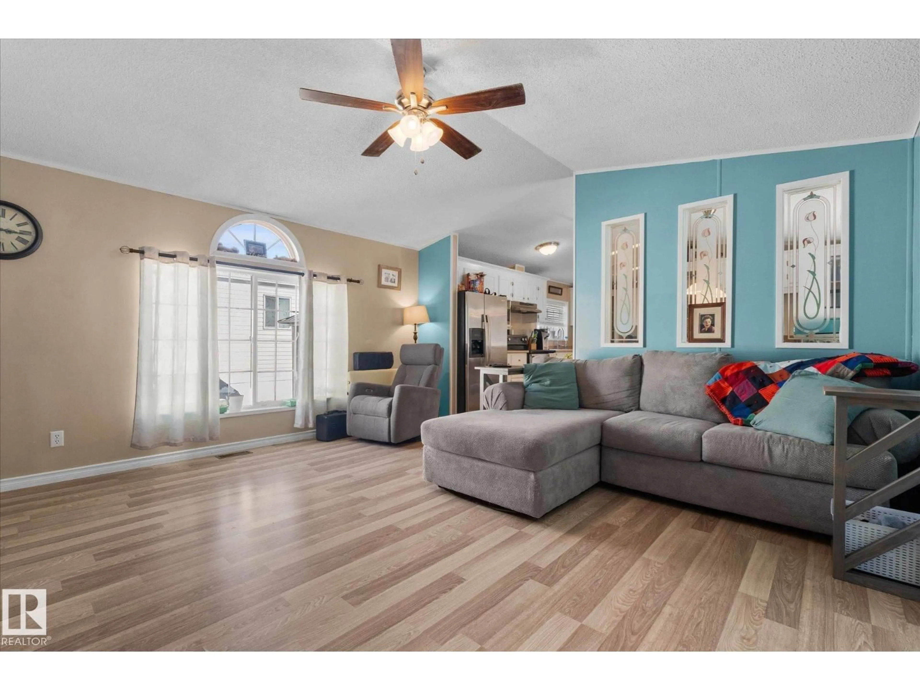 Living room with furniture, wood/laminate floor for 1503 JUBILEE DR, Sherwood Park Alberta T8H1M1
