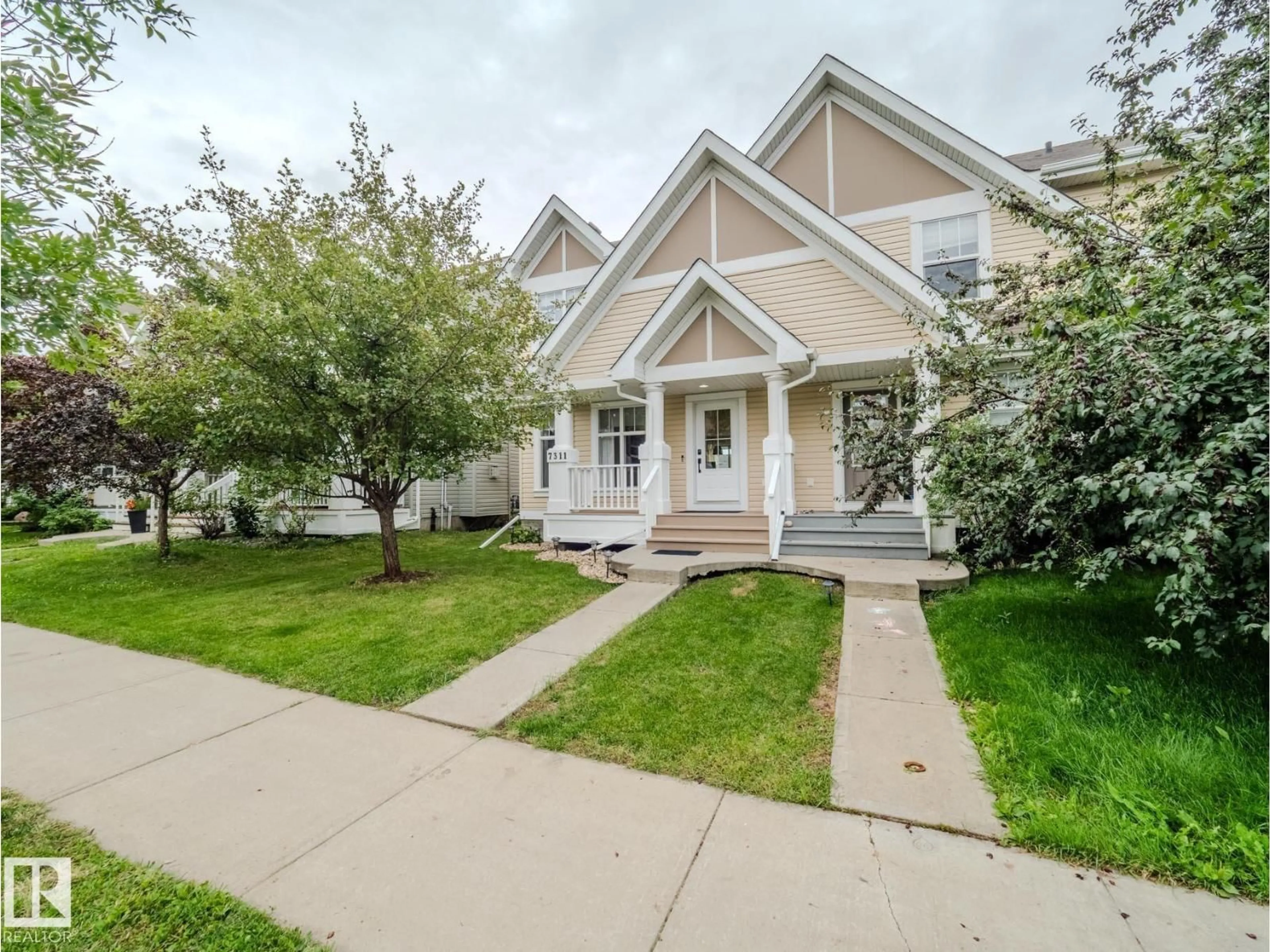 Home with vinyl exterior material, street for 7311 22 AV, Edmonton Alberta T6X0V6