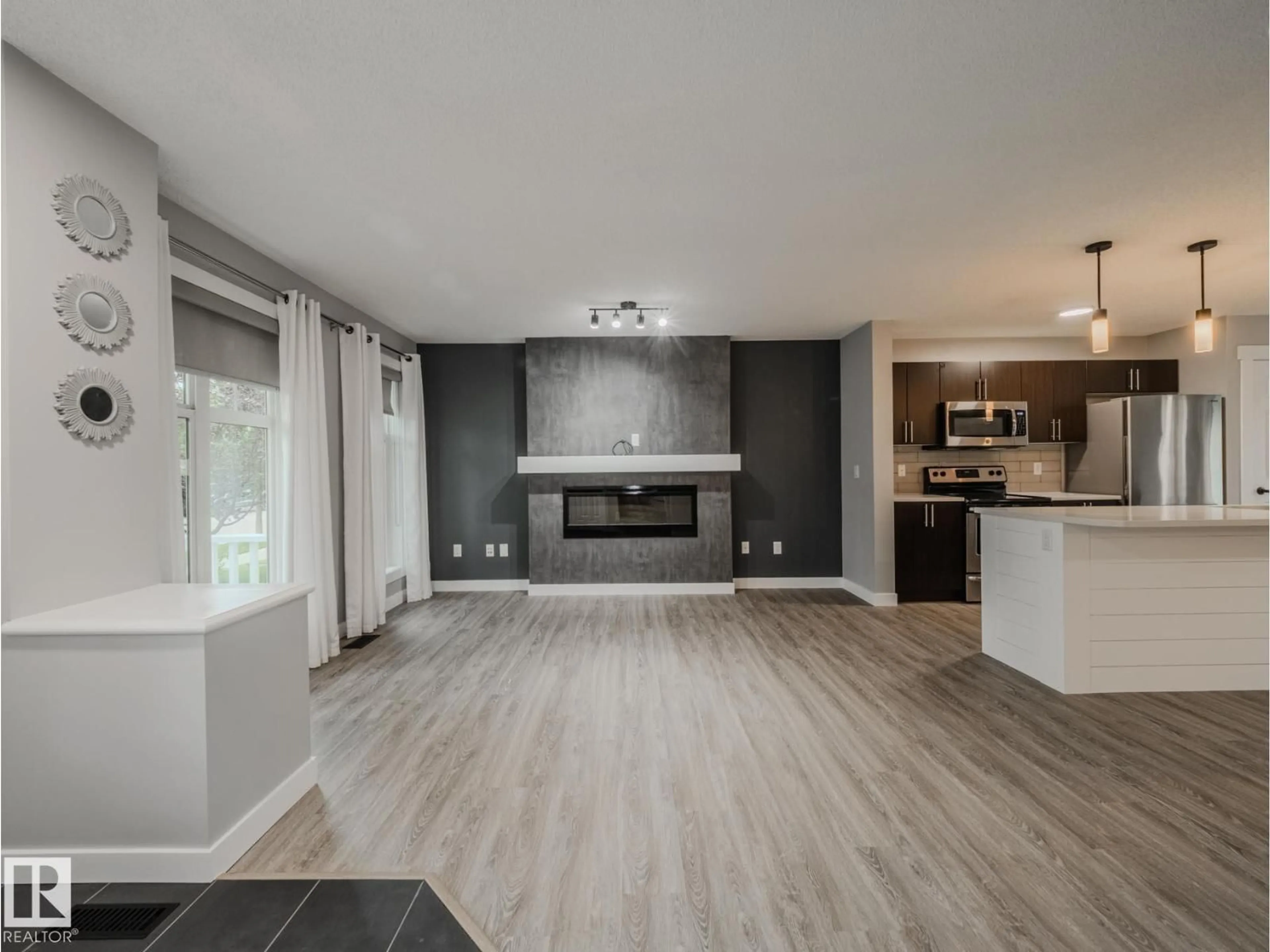 Open concept kitchen, wood/laminate floor for 7311 22 AV, Edmonton Alberta T6X0V6