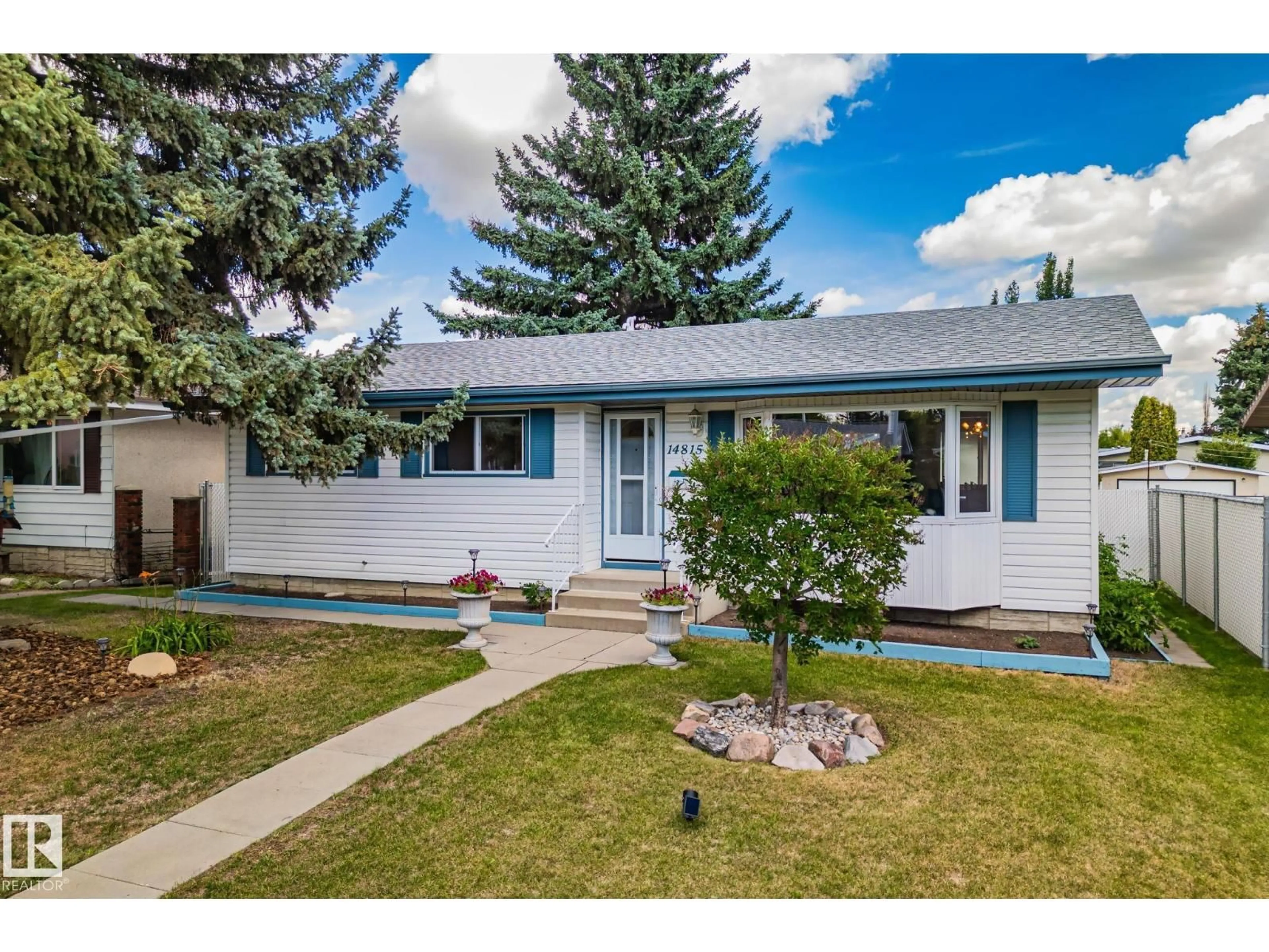 Home with vinyl exterior material, street for 14815 96 ST, Edmonton Alberta T5E4B9